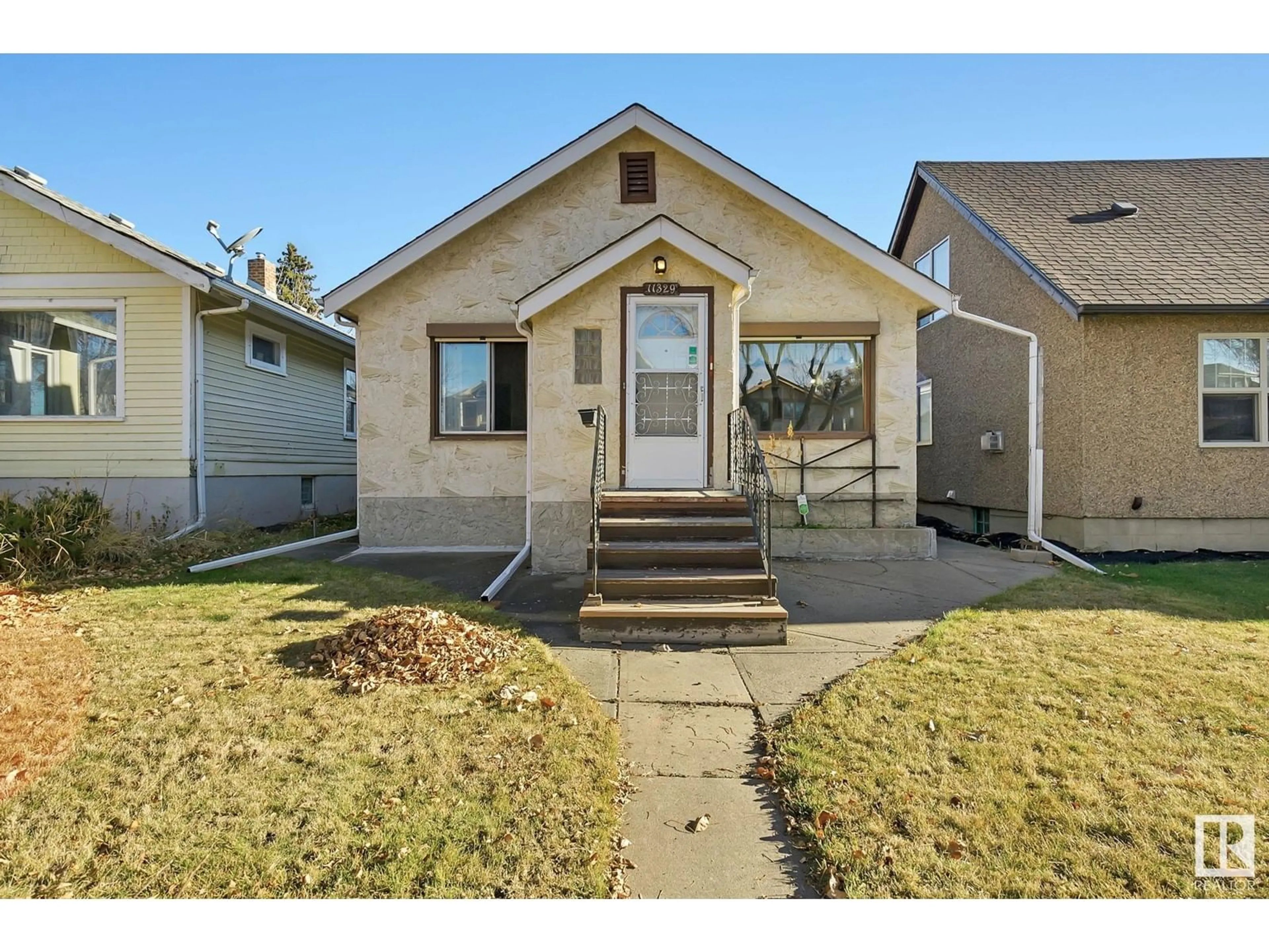 Frontside or backside of a home for 11329 94 ST NW, Edmonton Alberta T5G1H2