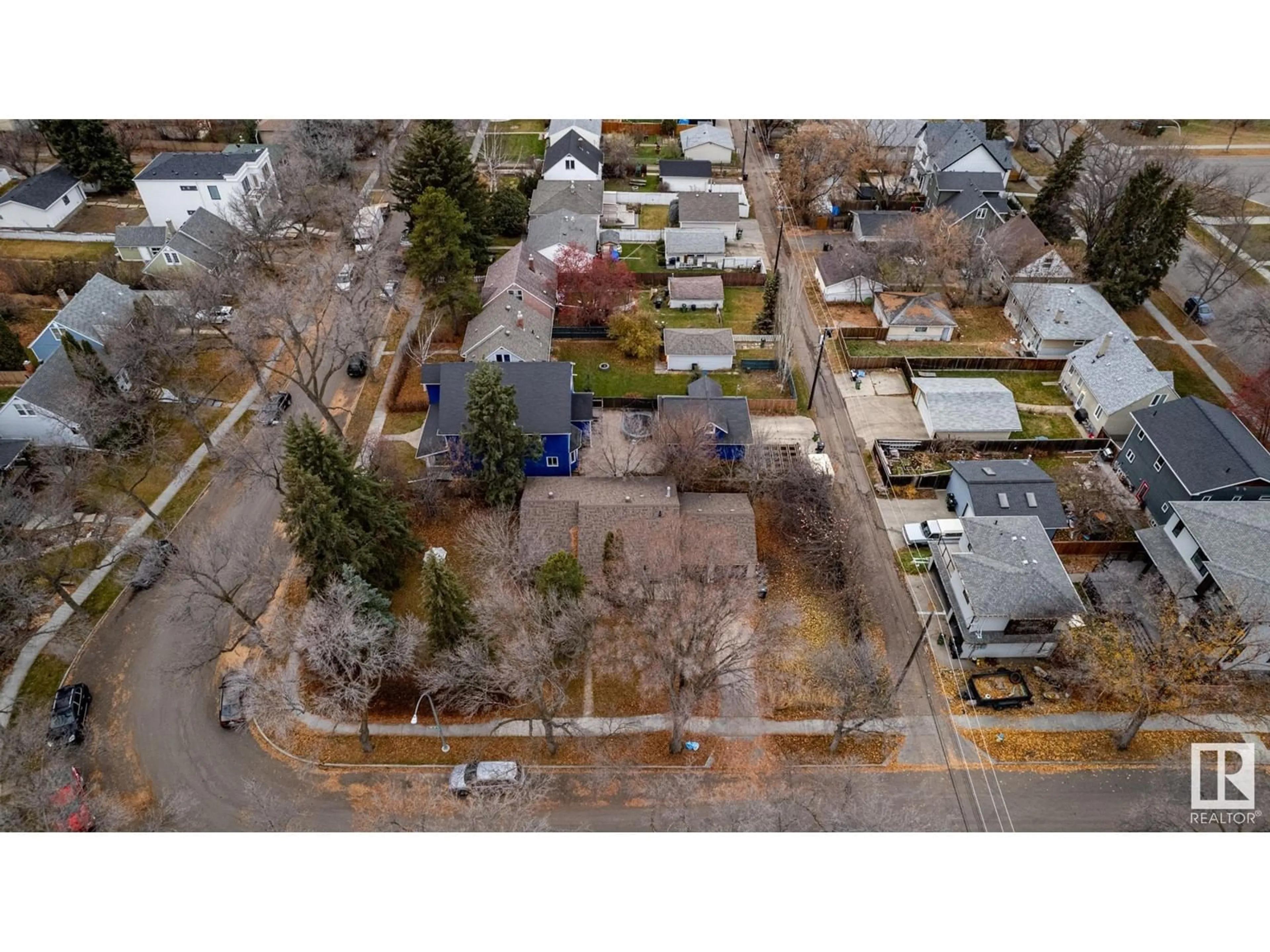 Frontside or backside of a home, the fenced backyard for 6404 110 ST NW, Edmonton Alberta T6H3E6