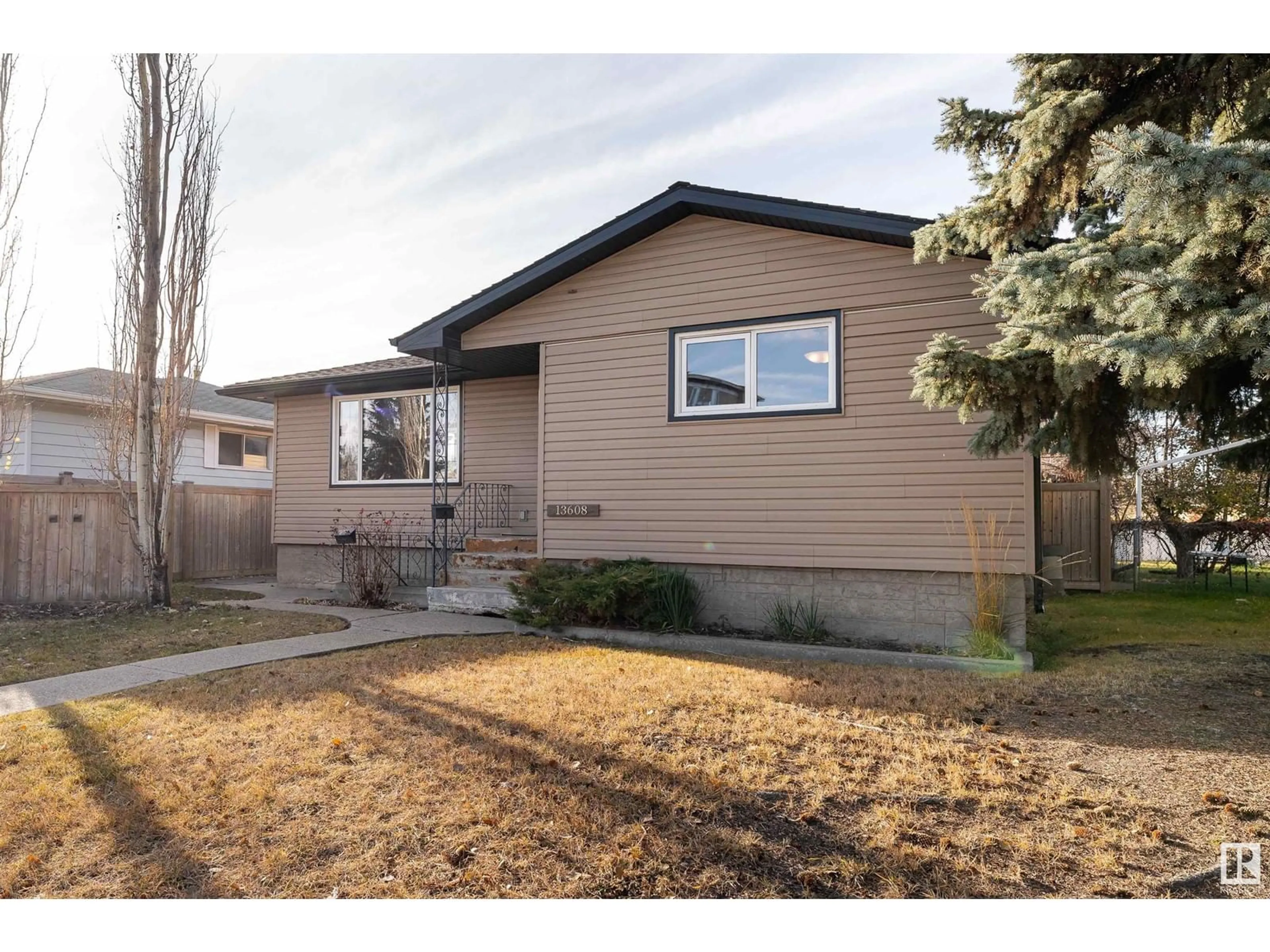 Frontside or backside of a home, the fenced backyard for 13608 119 ST NW, Edmonton Alberta T5E5N2