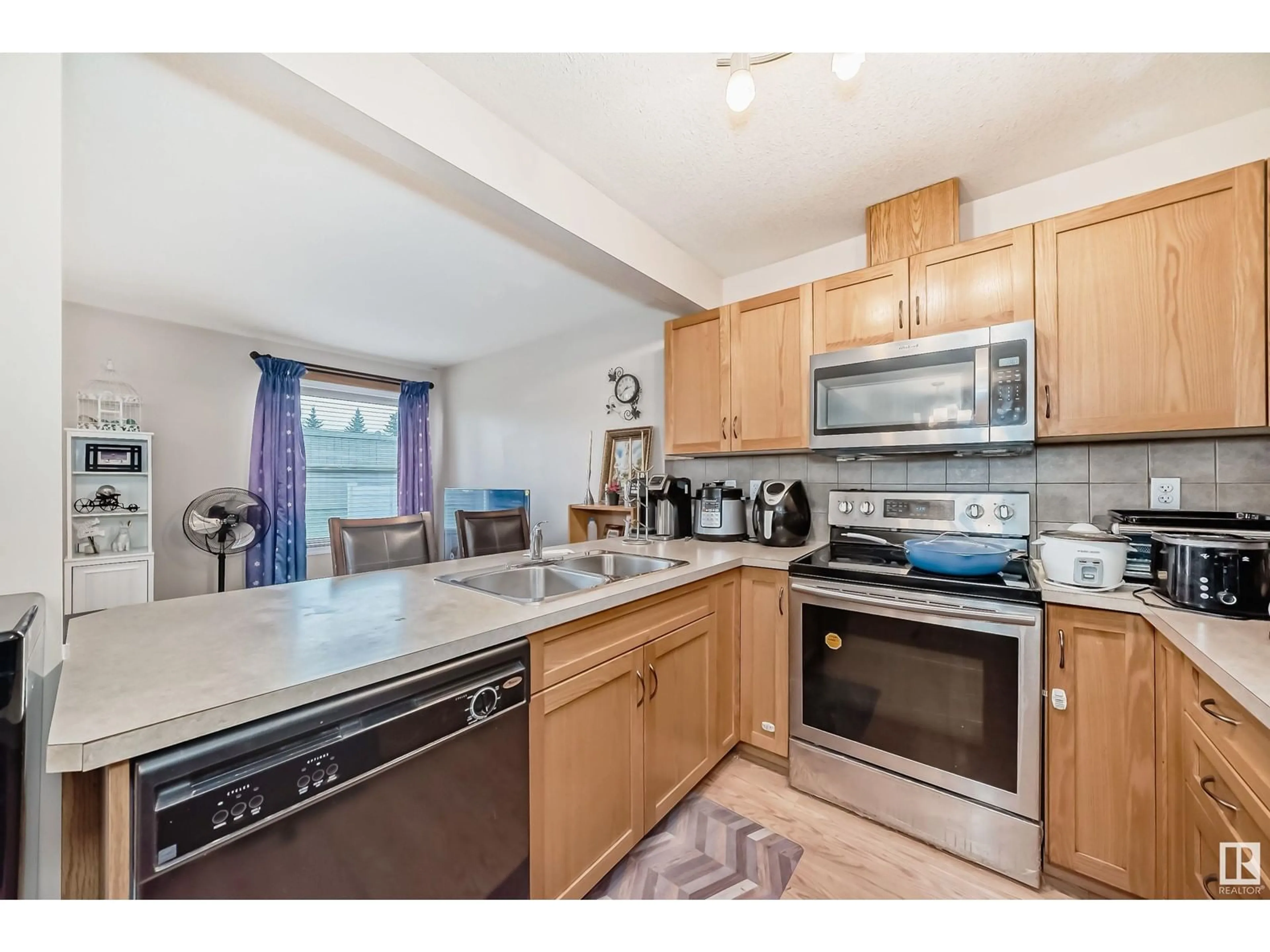 Standard kitchen, wood floors, cottage for #134 150 EDWARDS DR SW, Edmonton Alberta T6X1M4