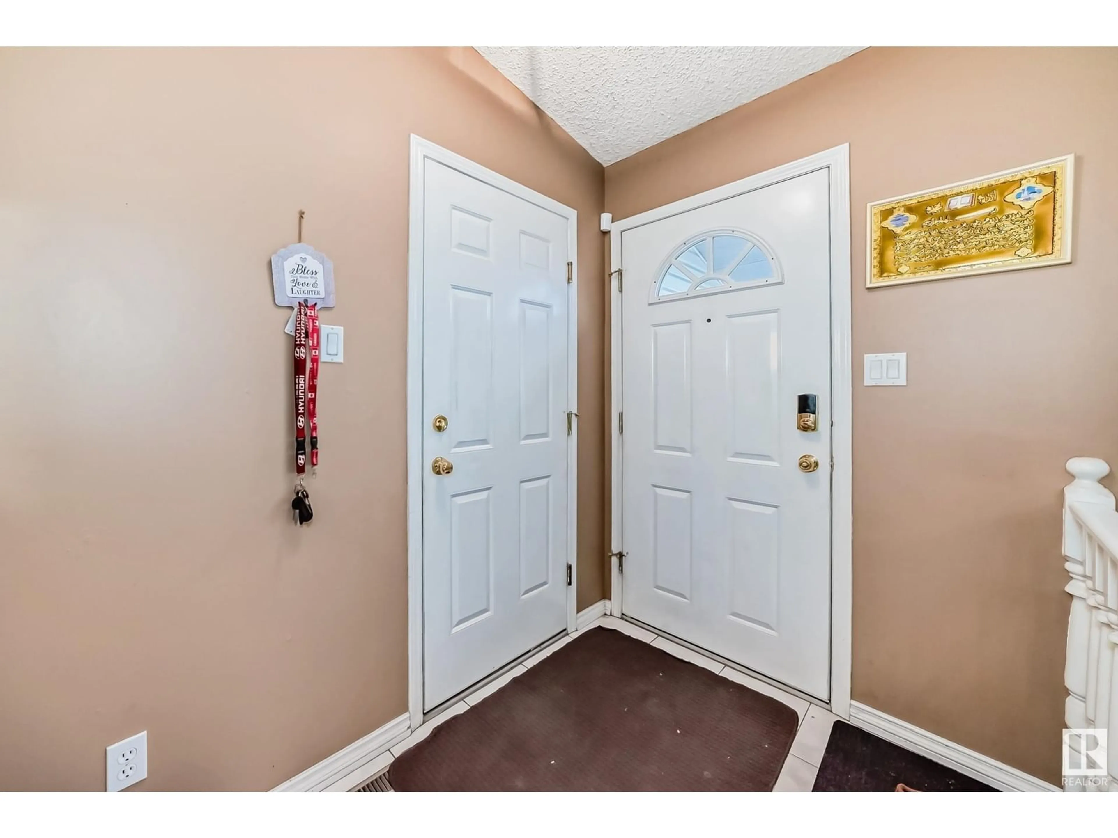 Indoor entryway, wood floors for 16212 60 ST NW, Edmonton Alberta T5Y2S2