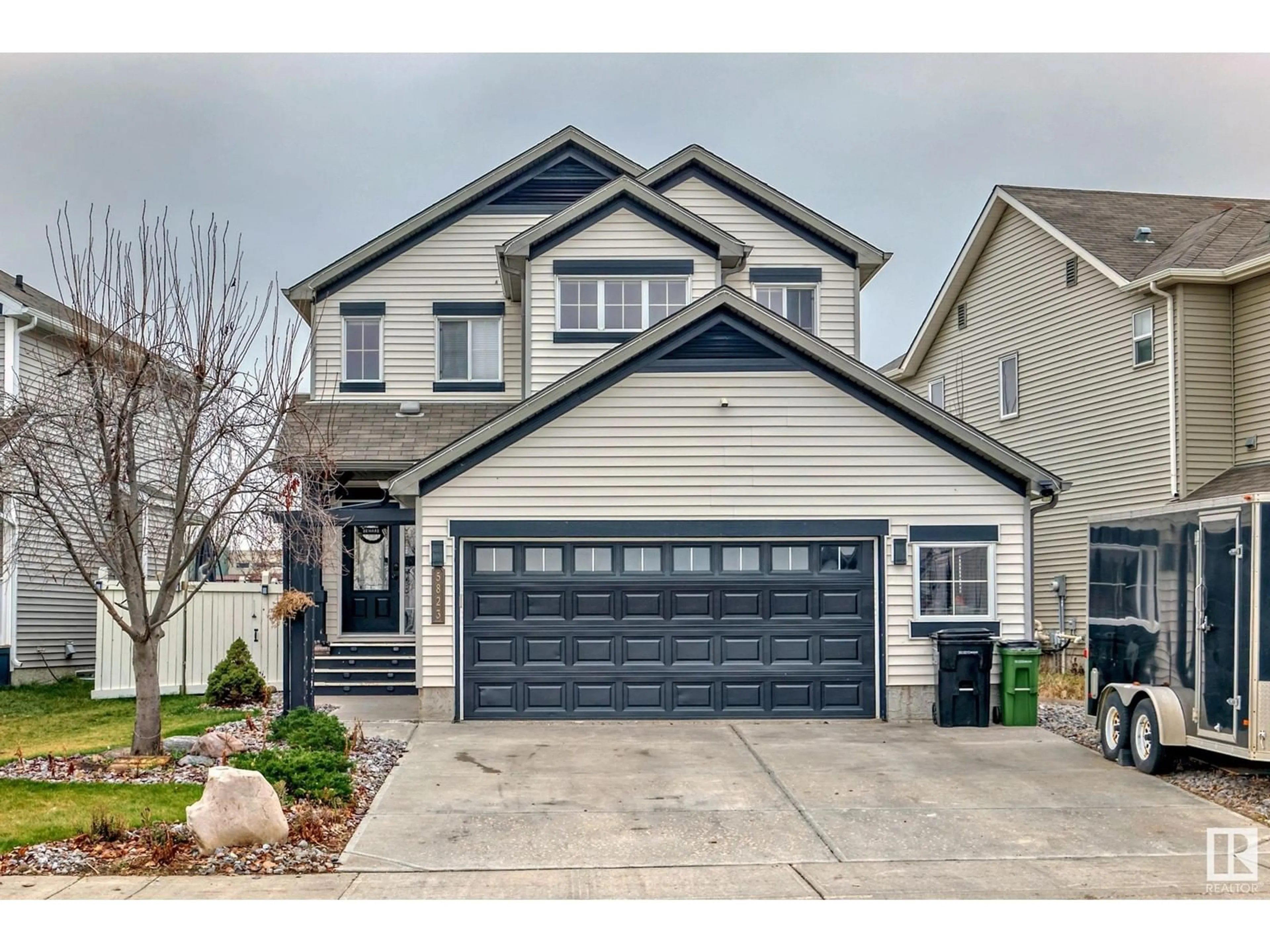 Frontside or backside of a home, the street view for 5823 12 AV SW, Edmonton Alberta T6X0T3