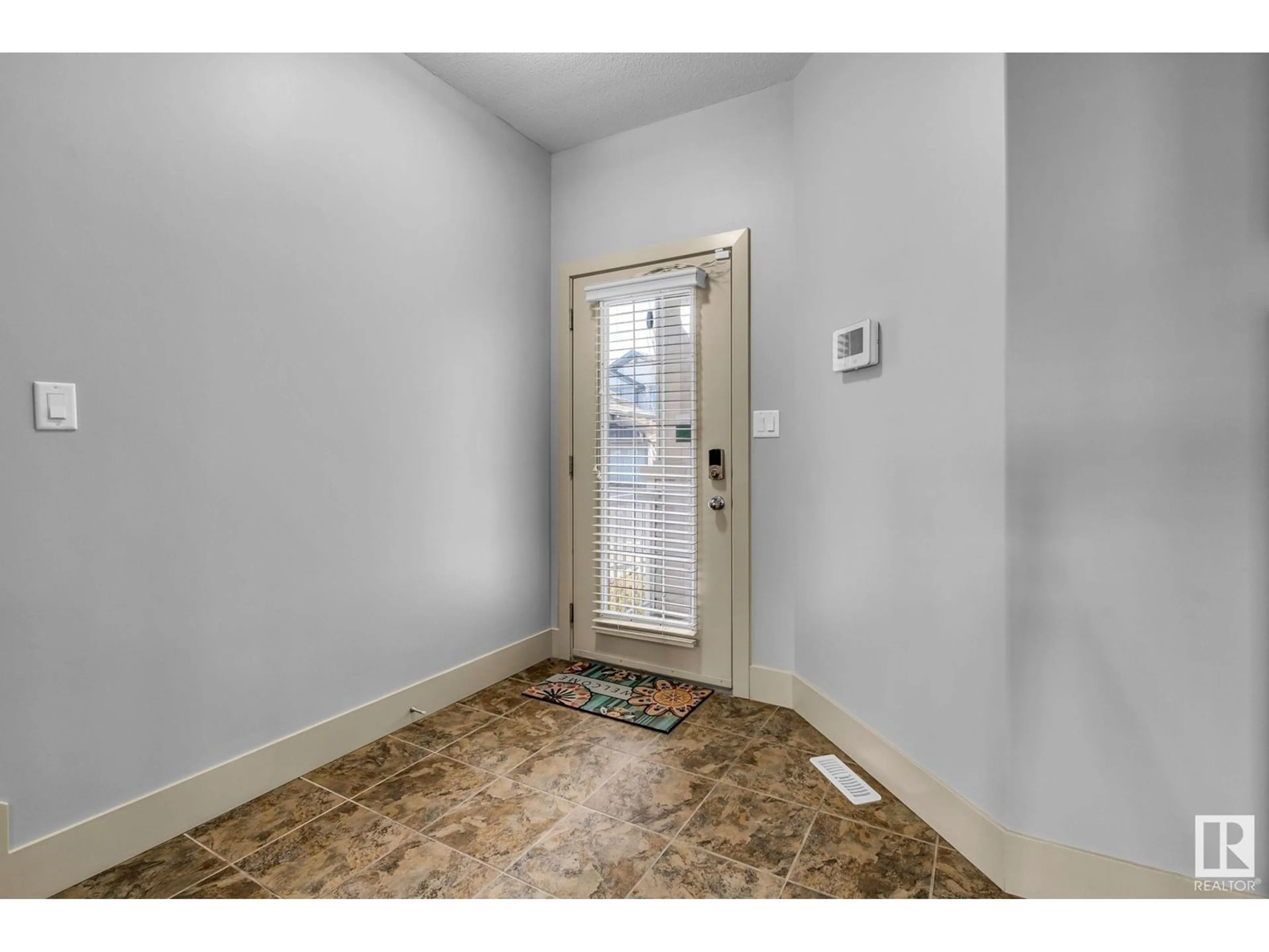 Indoor entryway, wood floors for #47 1901 126 ST SW SW, Edmonton Alberta T6W0R9