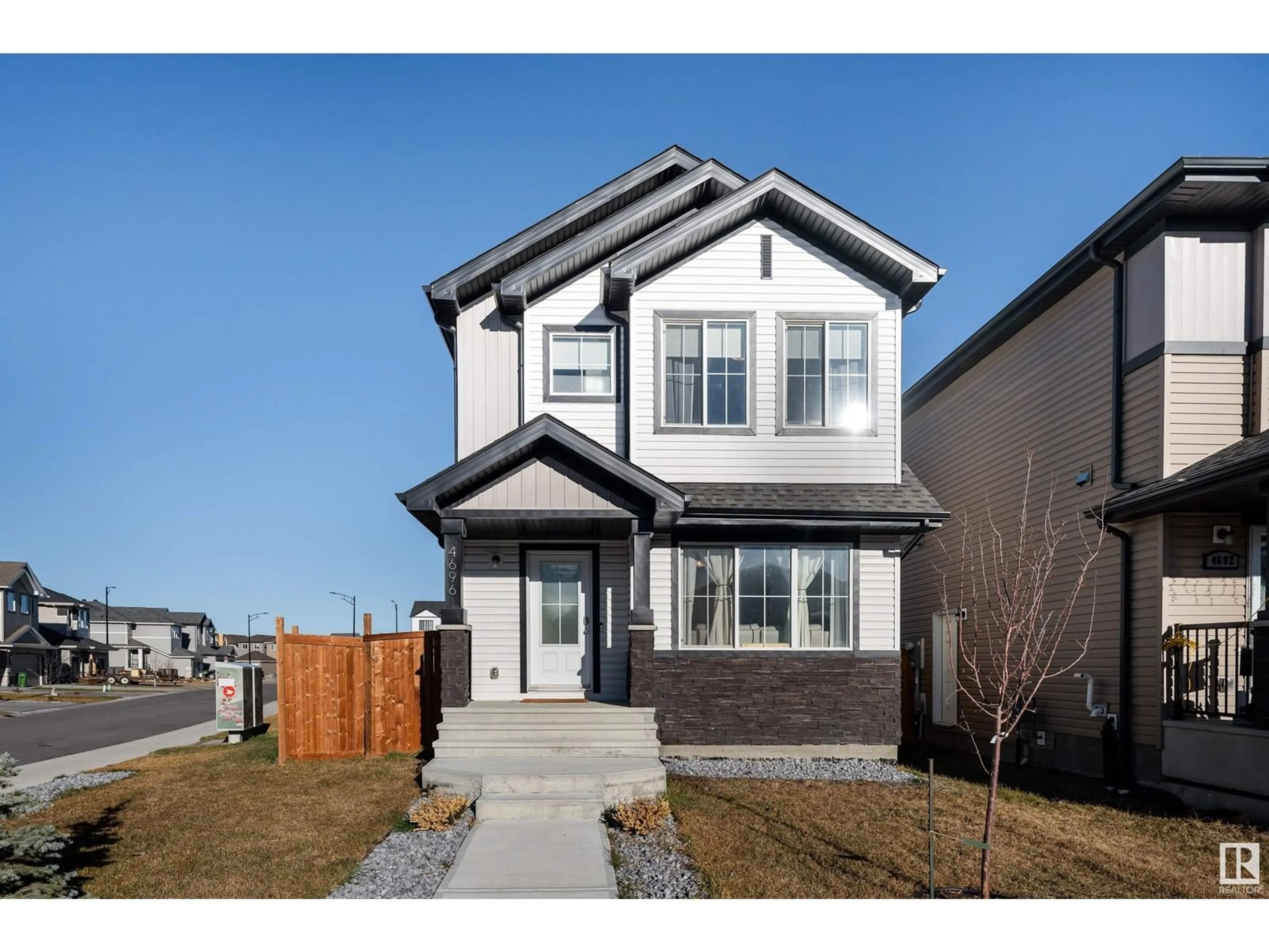 Frontside or backside of a home, the fenced backyard for 4696 175 AV NW, Edmonton Alberta T5Y3Z8