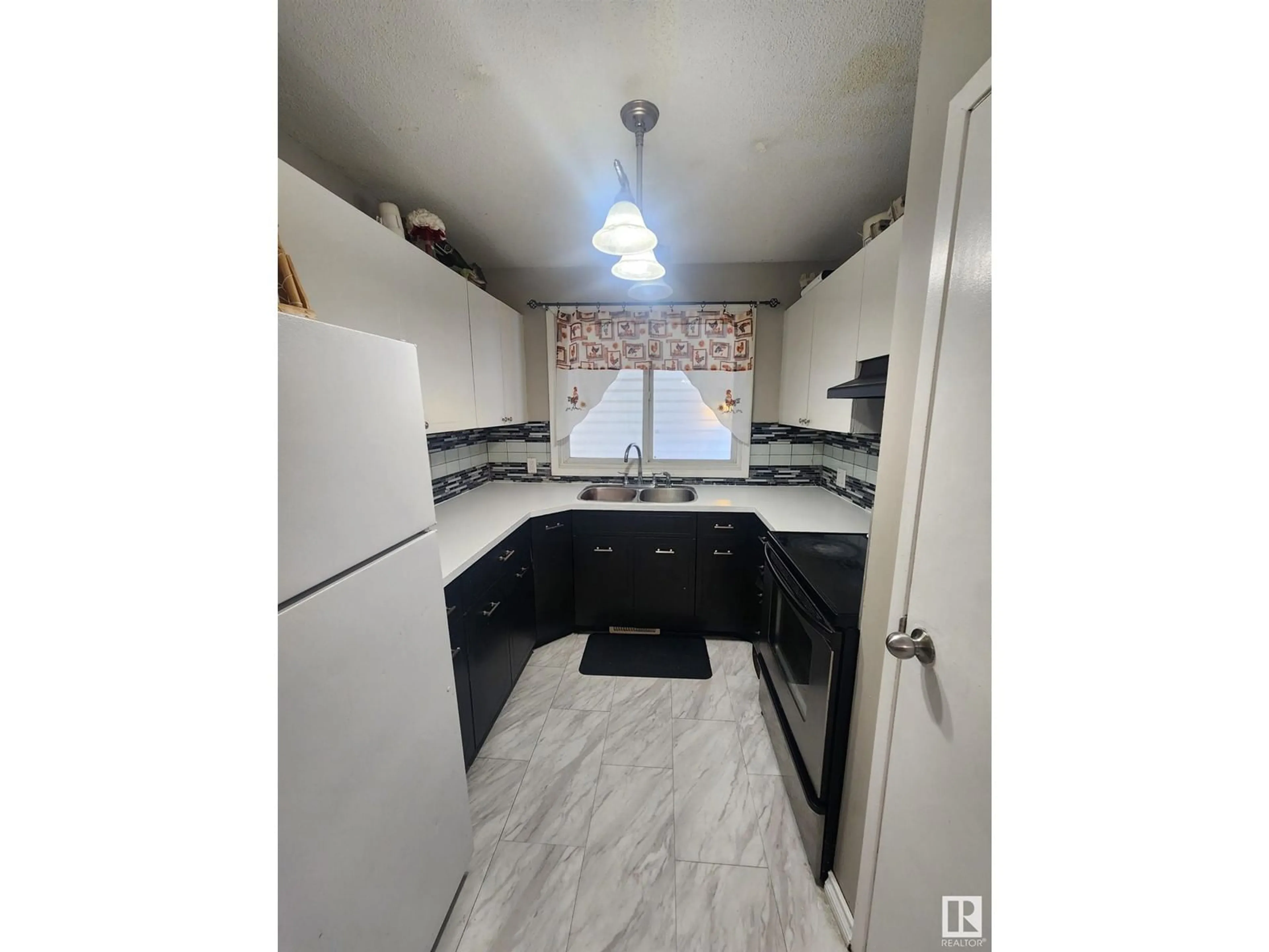 Open concept kitchen, ceramic/tile floor for 5114 52 ST, Bonnyville Town Alberta T9N2B2