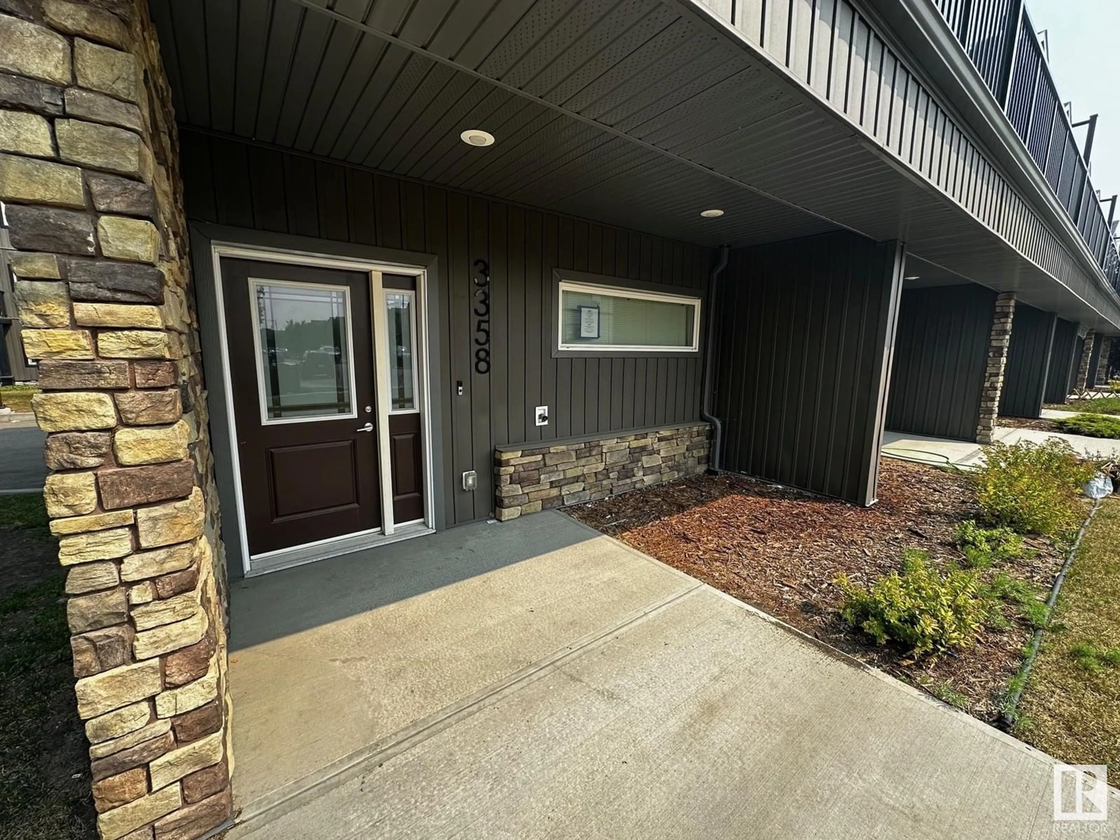 Indoor entryway, cement floor for 3358 15A AV NW, Edmonton Alberta T6T0Y1