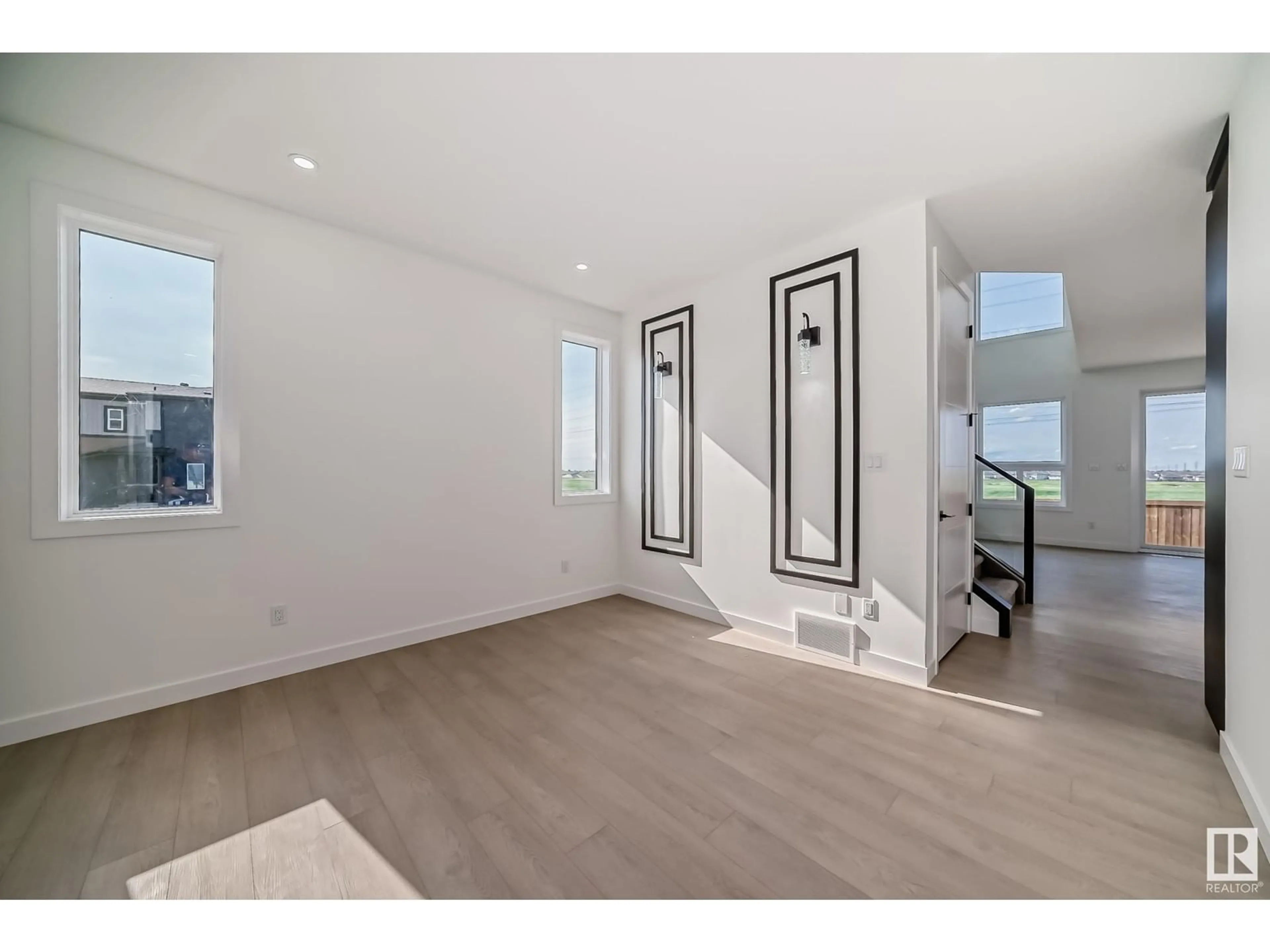 Indoor entryway, wood floors for 2804 1 AV SW, Edmonton Alberta T6X3E3