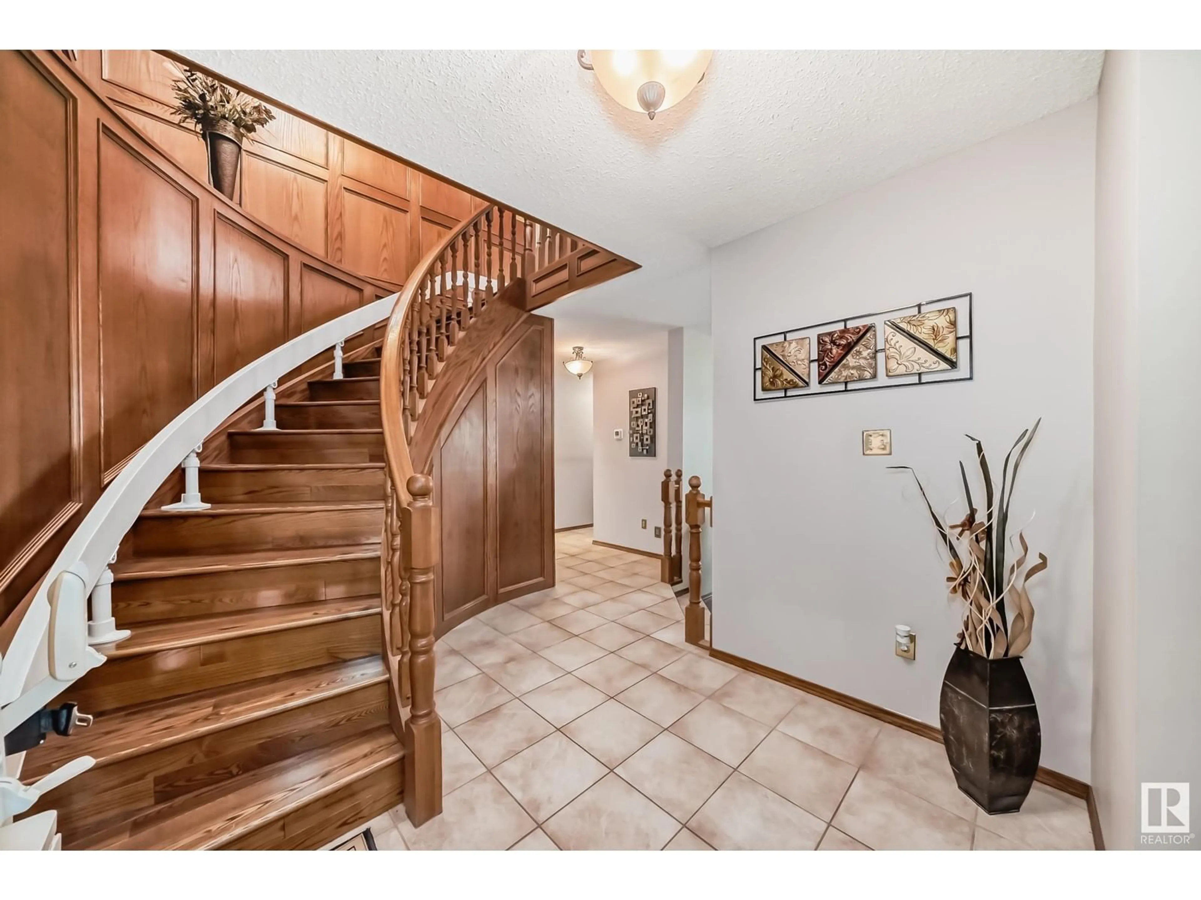 Indoor entryway, wood floors for 16124 100 ST NW, Edmonton Alberta T5X4R7