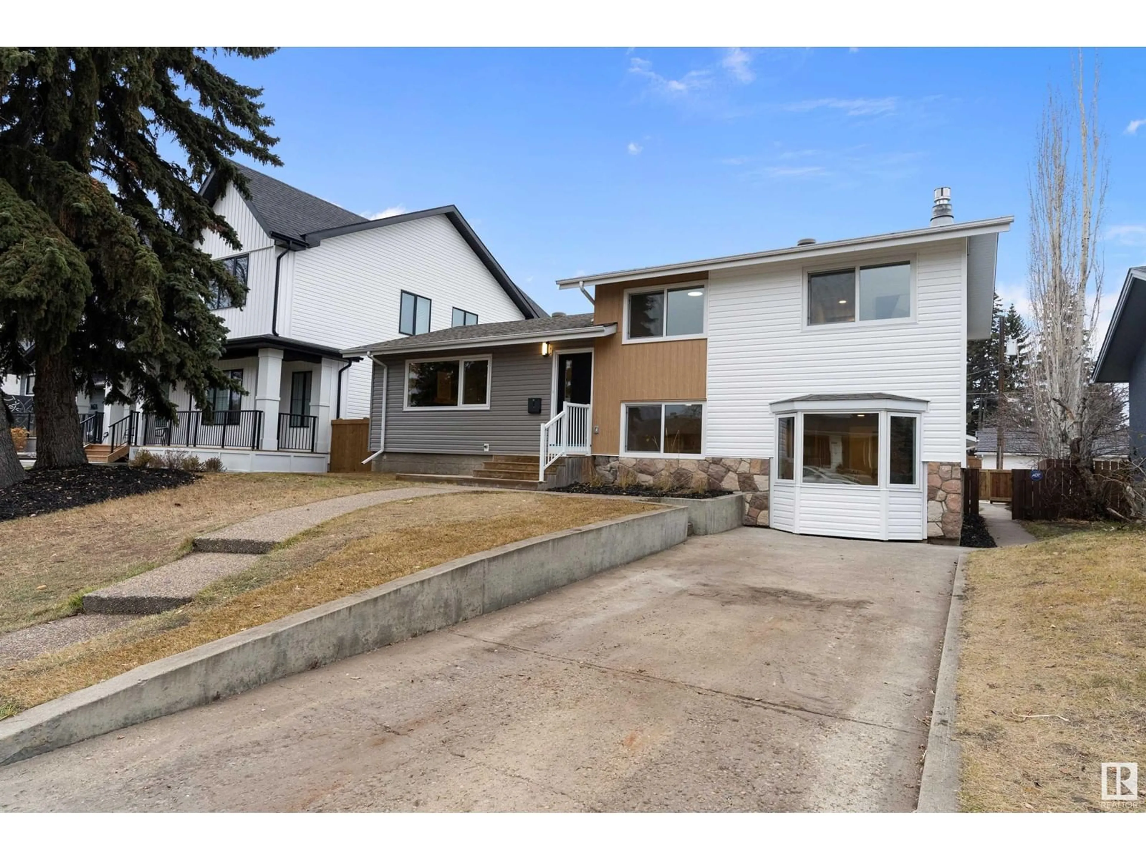 Frontside or backside of a home, the fenced backyard for 14616 88 AV NW, Edmonton Alberta T5R4J8