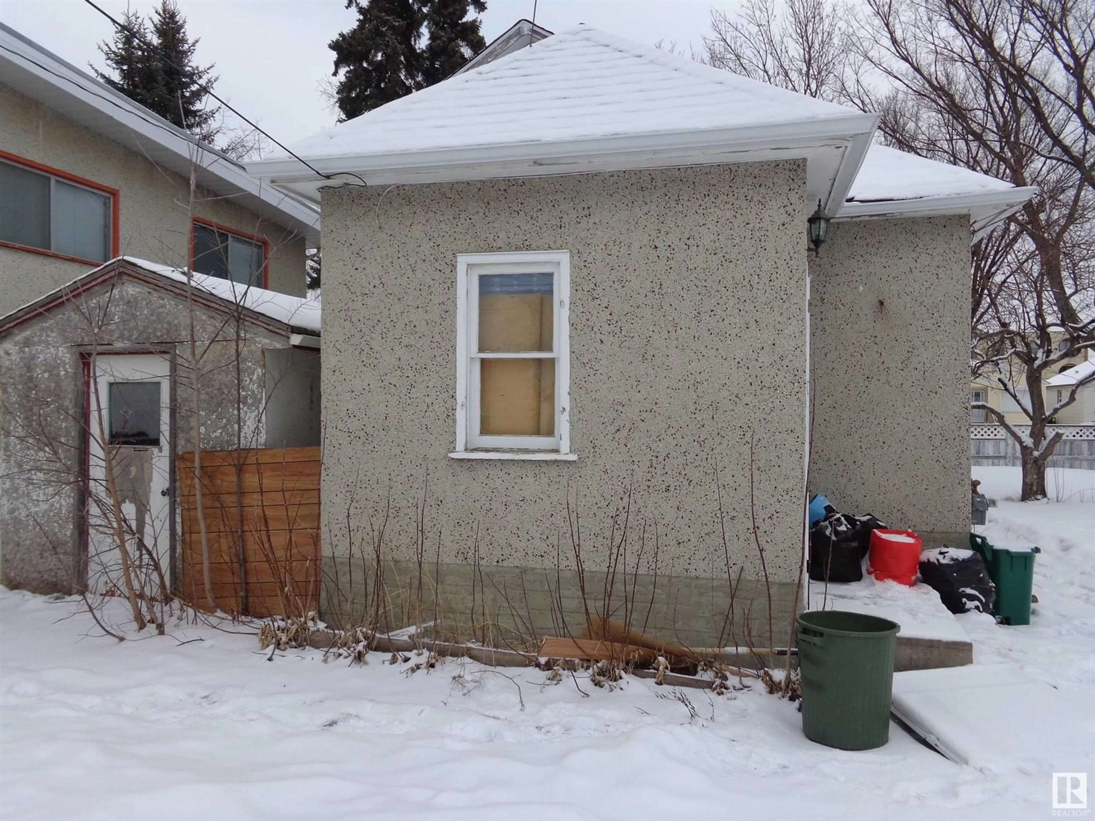 Frontside or backside of a home, the fenced backyard for 12044 79 ST NW, Edmonton Alberta T5B2L3