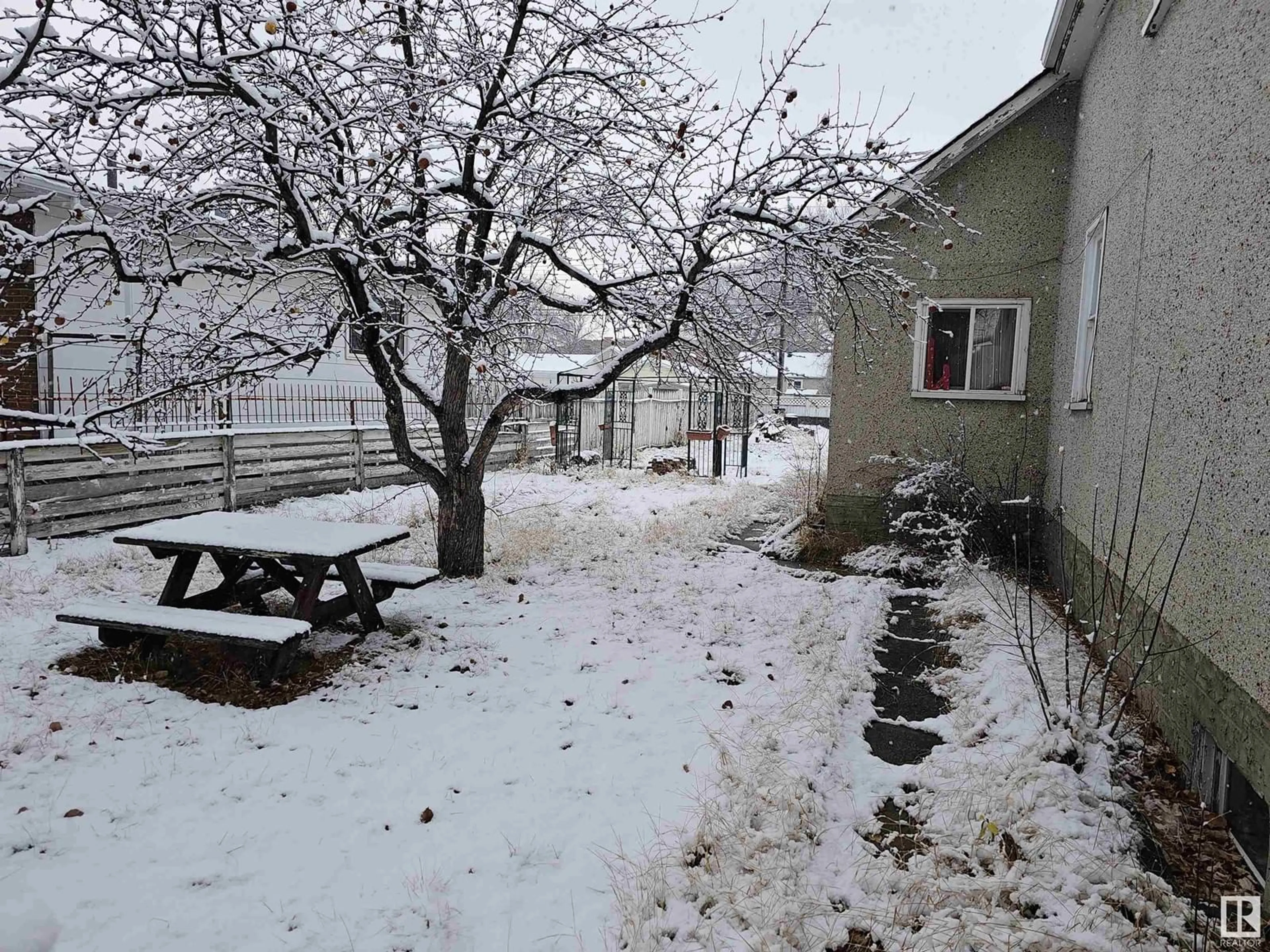 Patio, the fenced backyard for 12044 79 ST NW, Edmonton Alberta T5B2L3