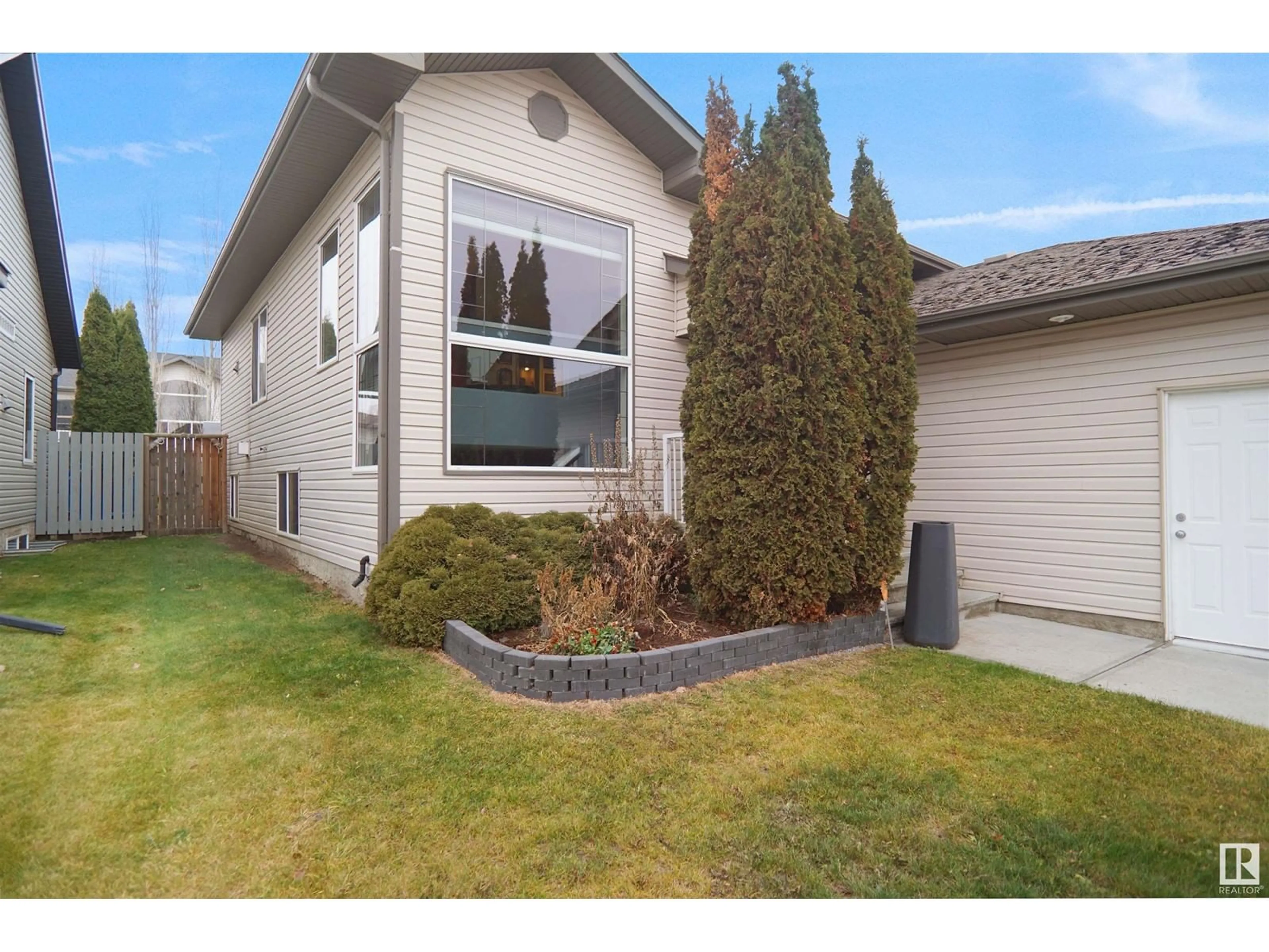 Frontside or backside of a home, the fenced backyard for 1445 HIGHWOOD BV, Devon Alberta T9G2E9