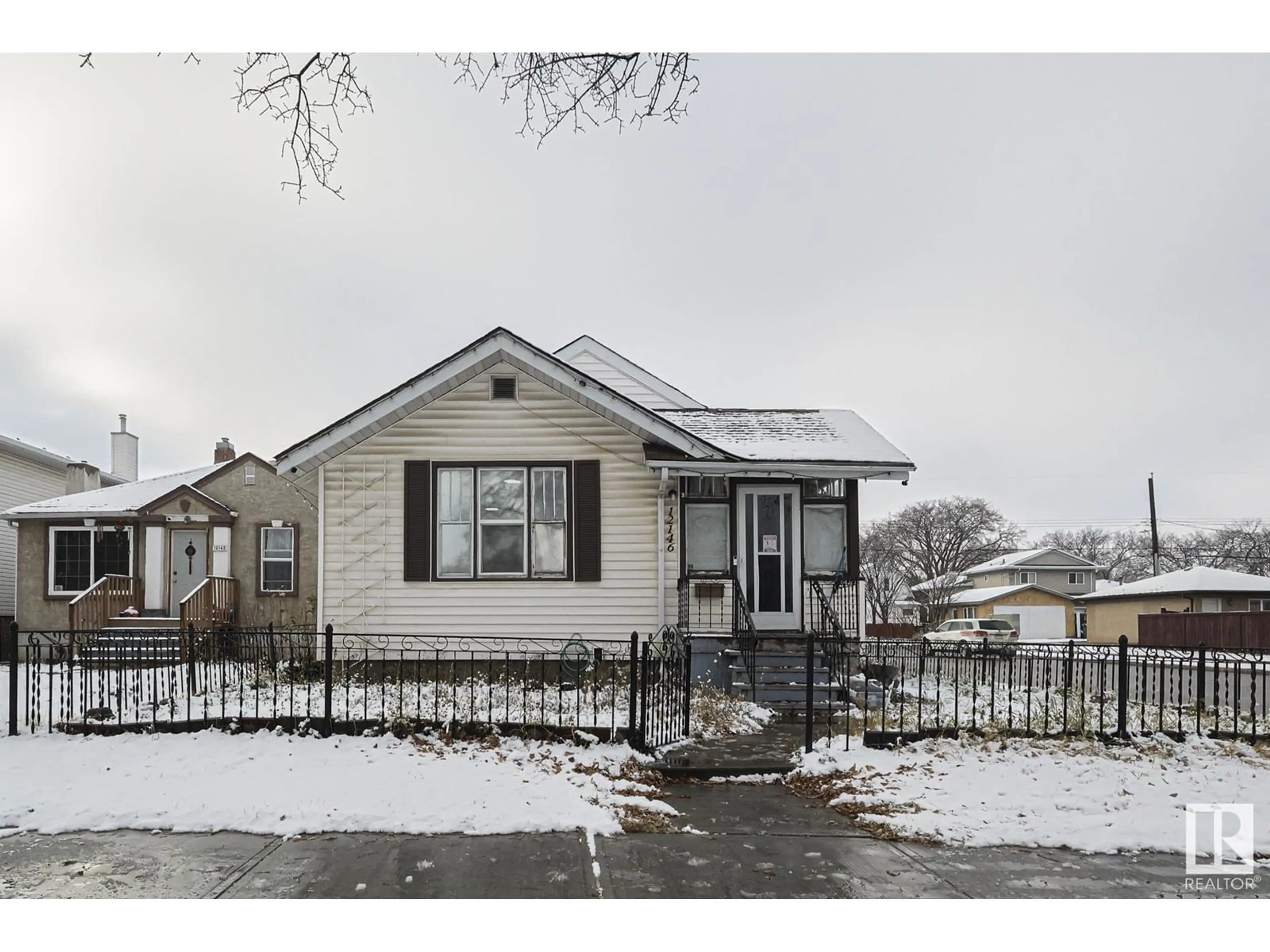 Frontside or backside of a home, the street view for 12146 94 ST NW, Edmonton Alberta T5G1J9