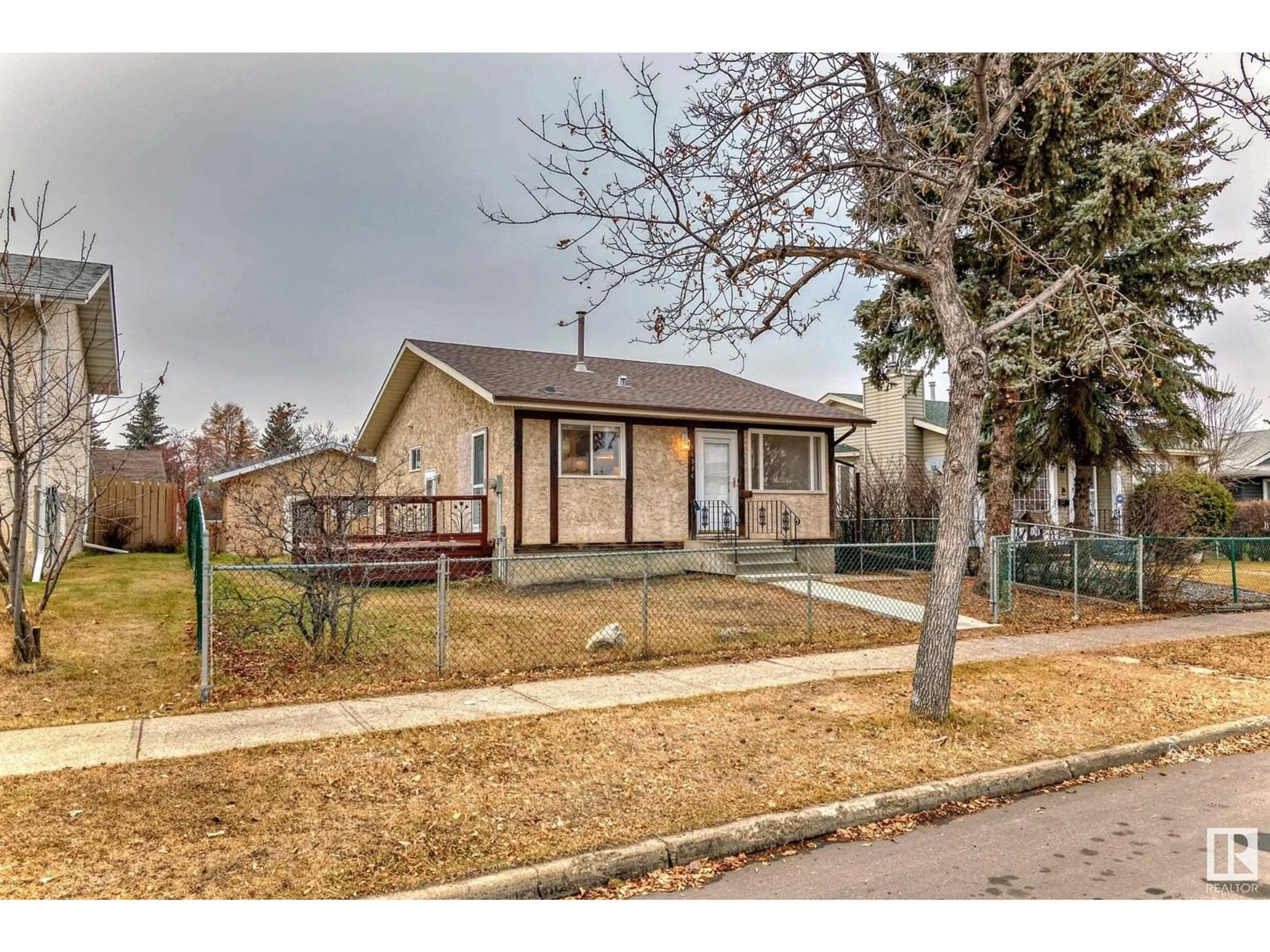 A pic from exterior of the house or condo, the fenced backyard for 16916 91 ST NW, Edmonton Alberta T5Z1W6