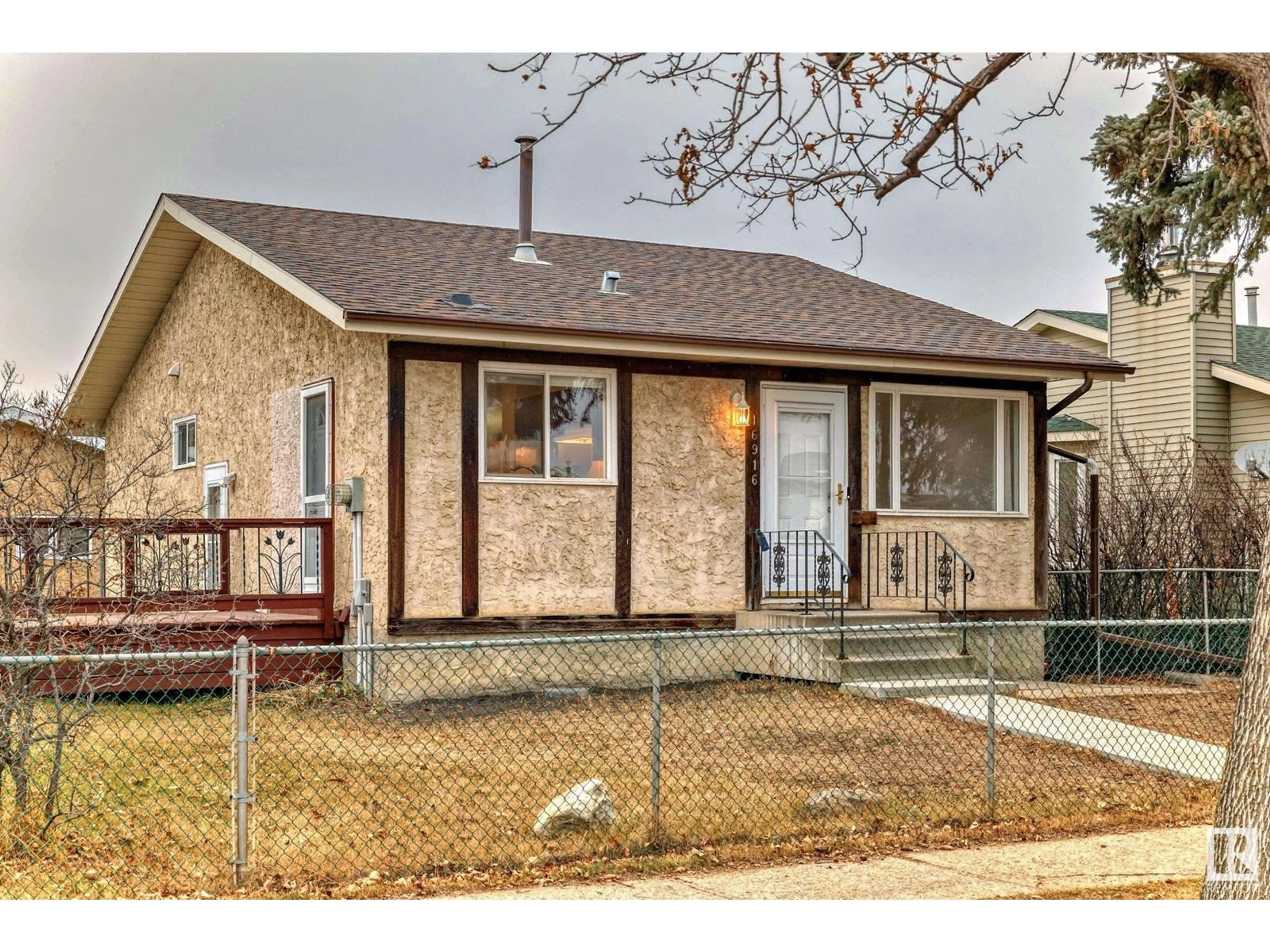 Frontside or backside of a home, the fenced backyard for 16916 91 ST NW, Edmonton Alberta T5Z1W6