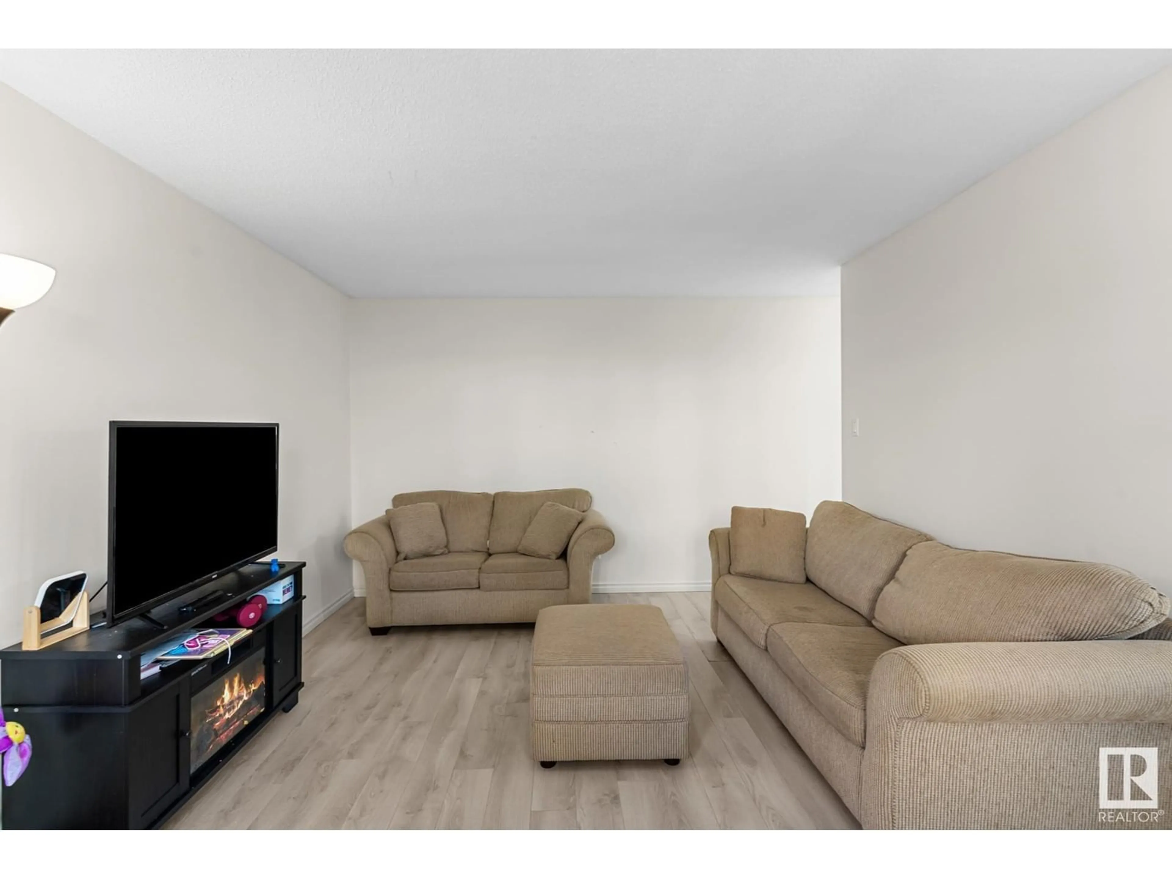 Living room, wood floors for #102 10145 113 ST NW, Edmonton Alberta T5K1P1