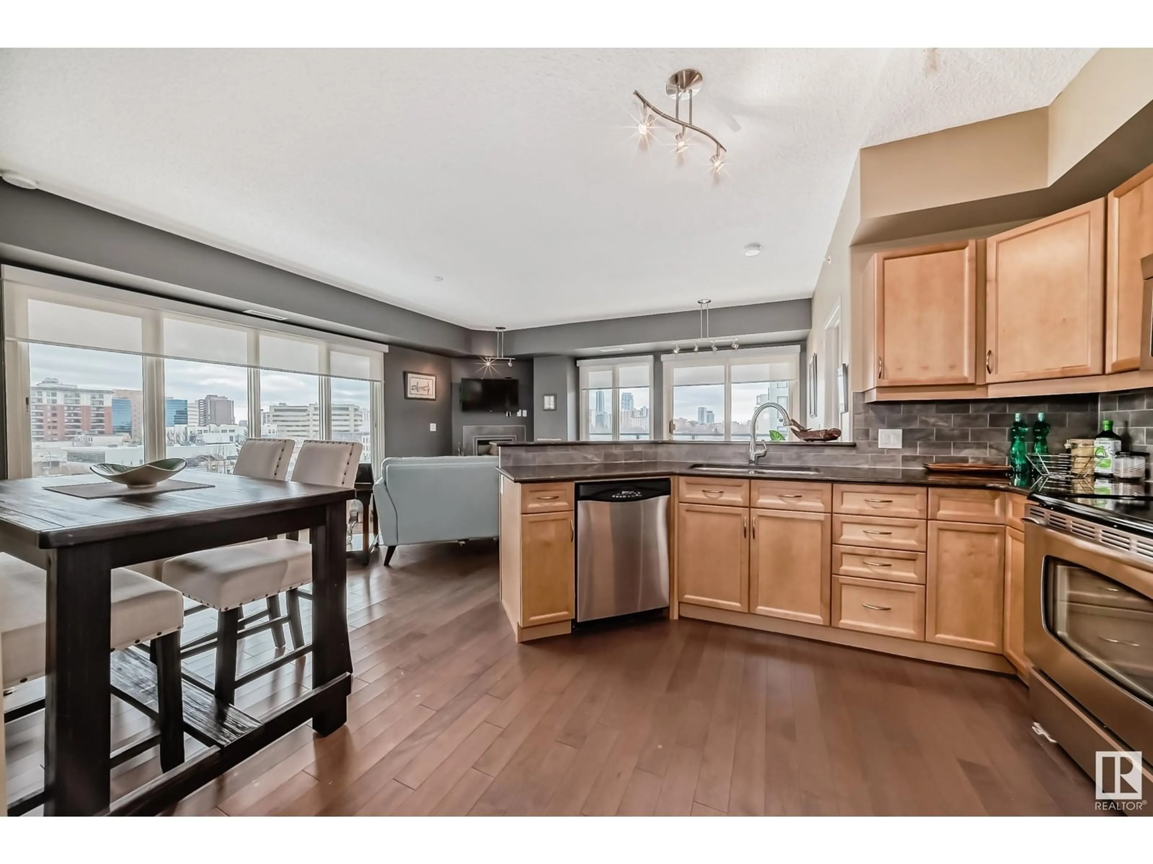 Open concept kitchen, wood/laminate floor for #503 10303 111 ST NW, Edmonton Alberta T5K0C6