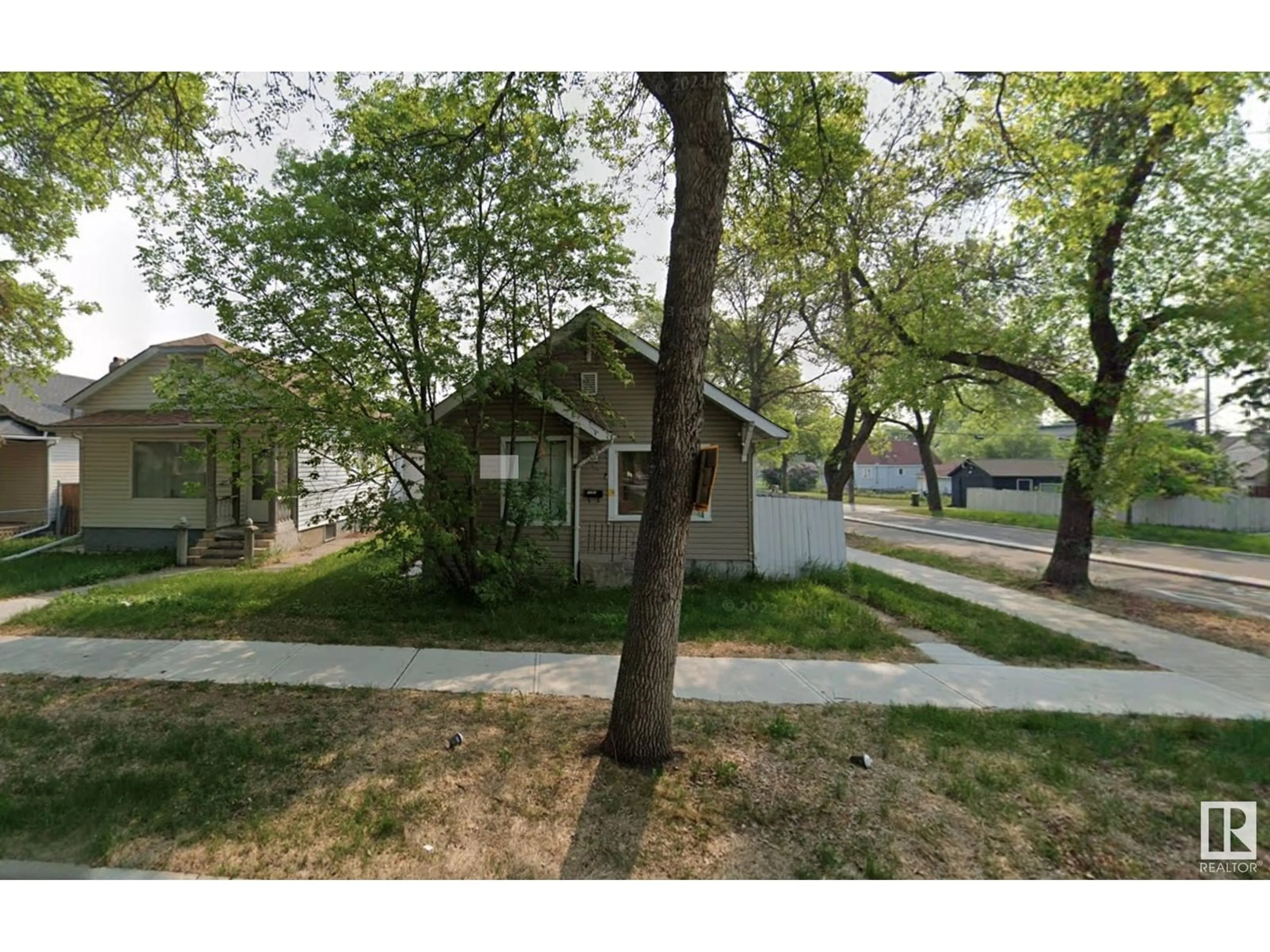 Frontside or backside of a home, the street view for 11903 94 ST NW, Edmonton Alberta T5G1J6