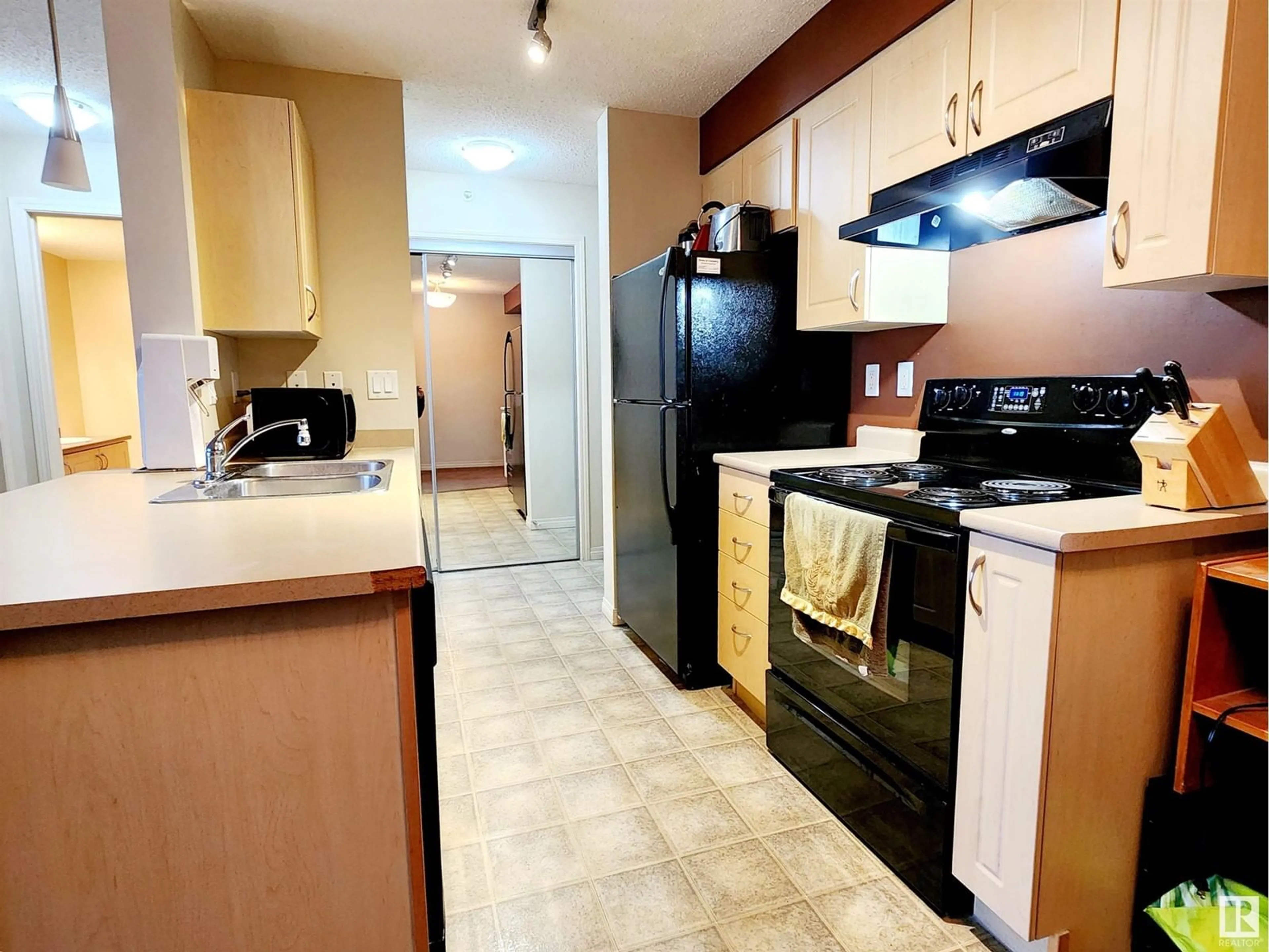 Standard kitchen, wood floors for #421 13907 136 ST NW, Edmonton Alberta T6V1Y5