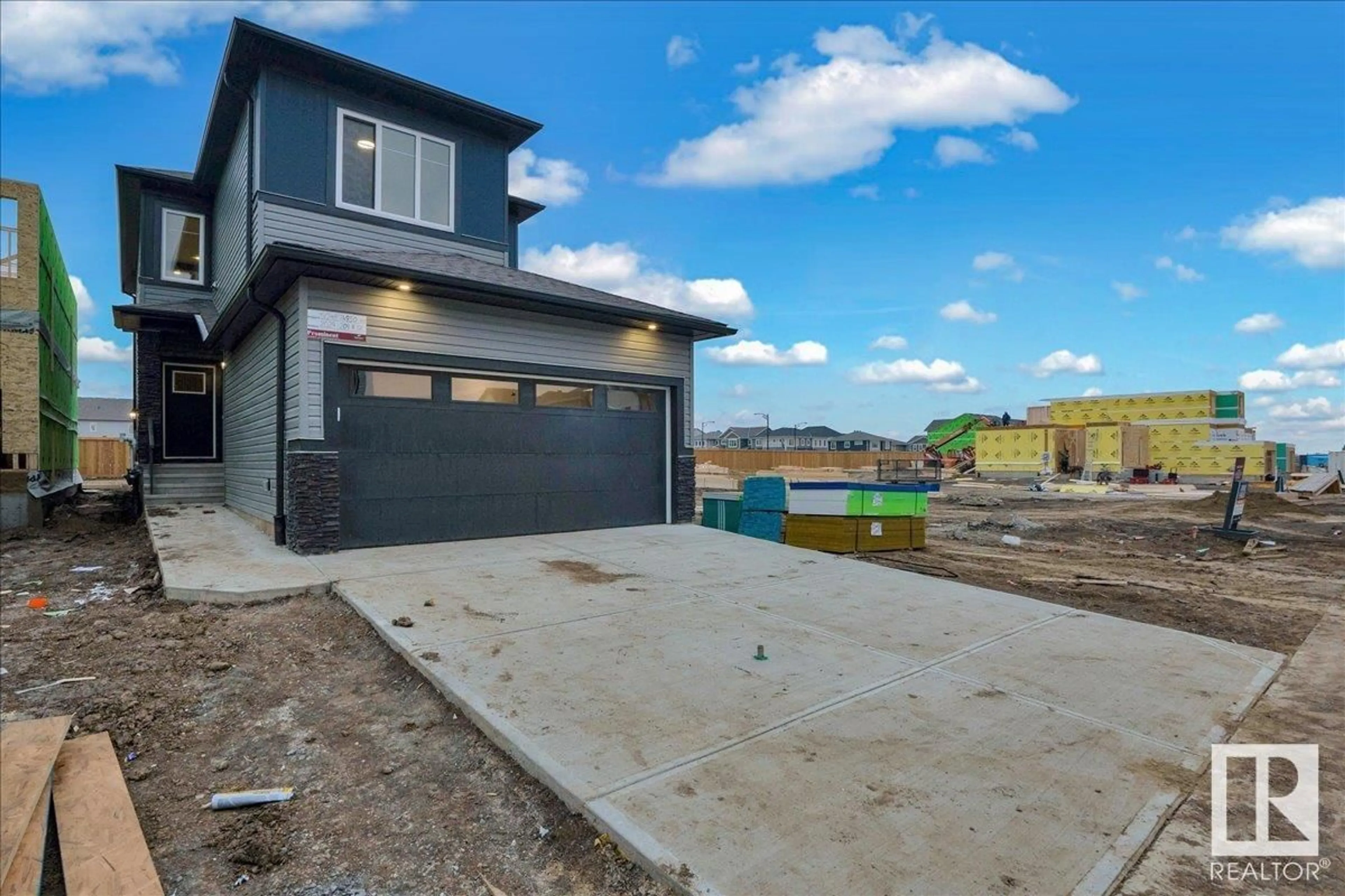 Frontside or backside of a home, the fenced backyard for 2029 209A ST NW, Edmonton Alberta T6M3C8