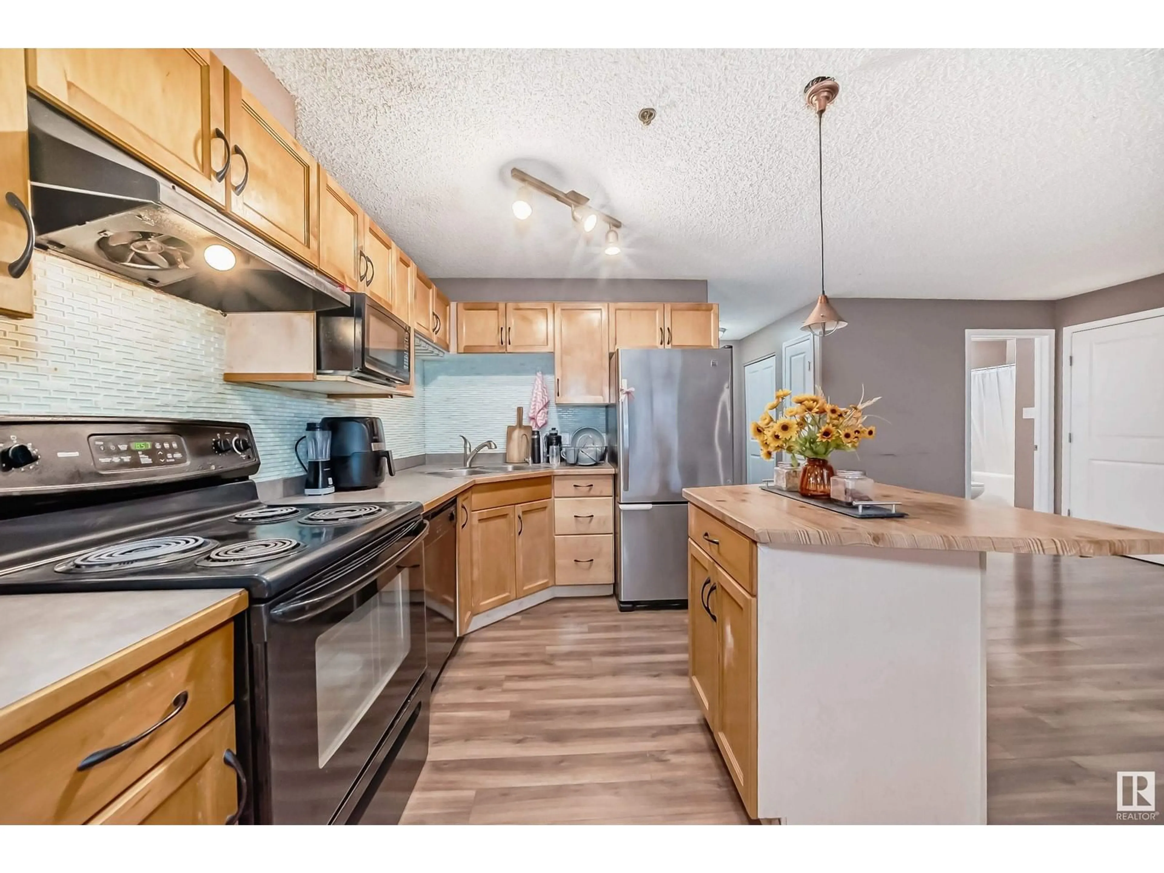 Standard kitchen, wood floors for #110 2305 35A AV NW, Edmonton Alberta T6T1Z2