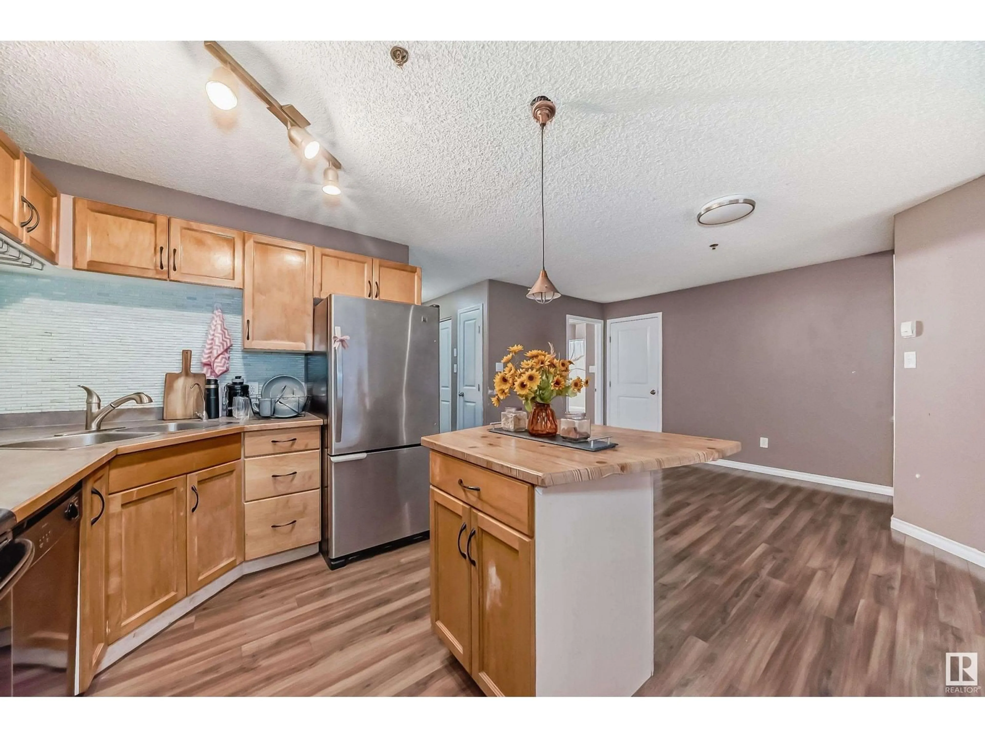 Open concept kitchen for #110 2305 35A AV NW, Edmonton Alberta T6T1Z2