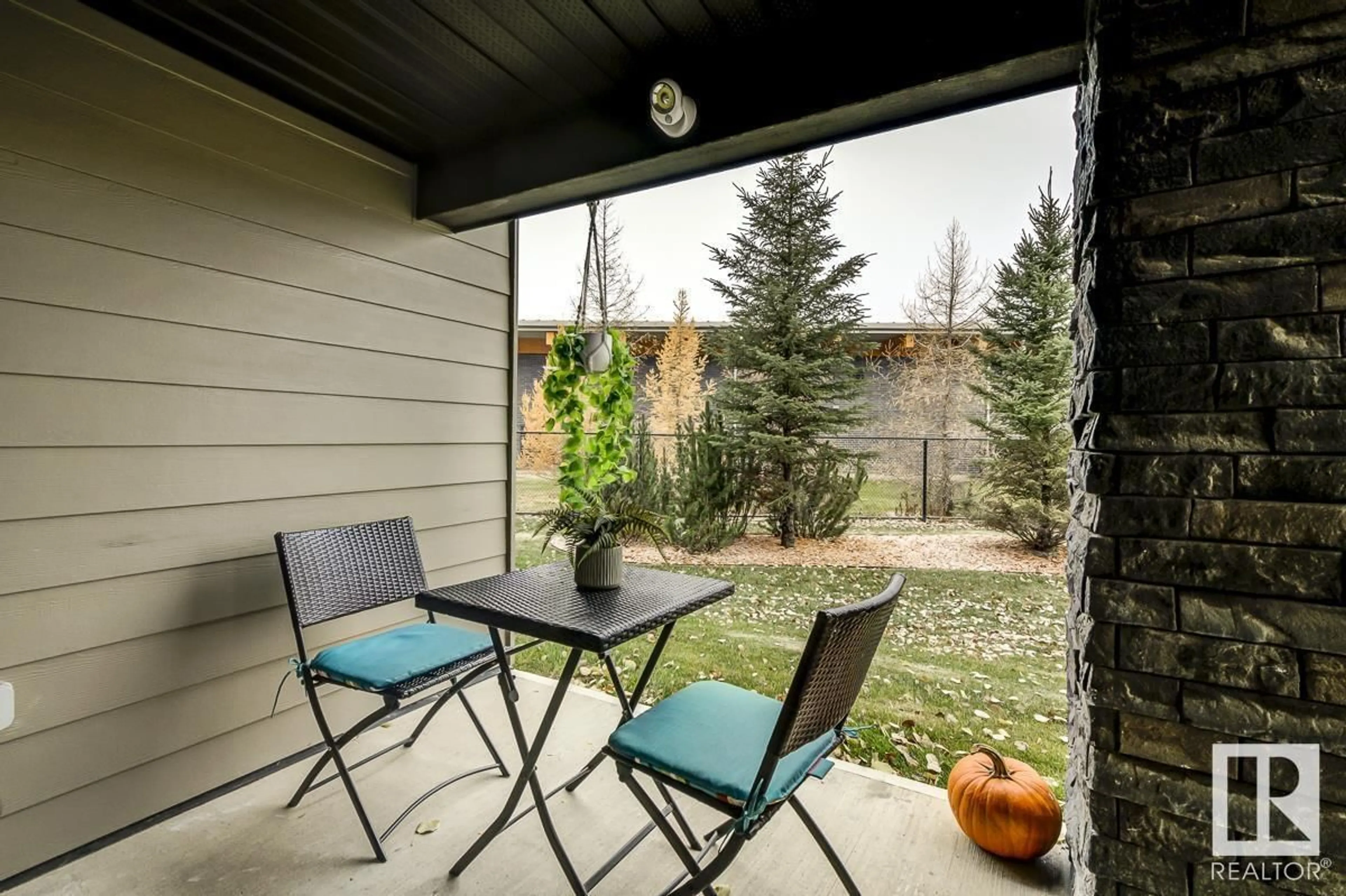 Patio, the fenced backyard for #114 12045 22 AV SW, Edmonton Alberta T6W2Y2