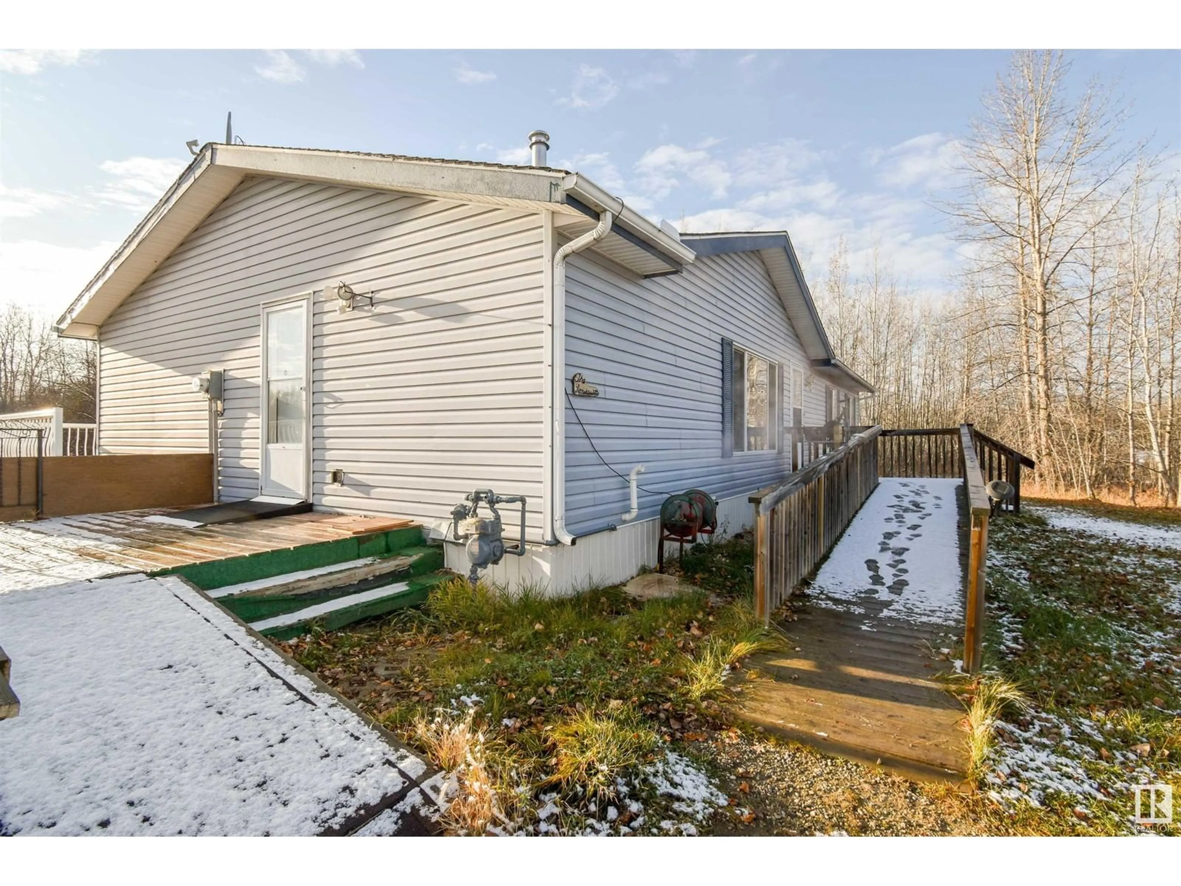 Frontside or backside of a home, the fenced backyard for 50 54222 Rge Rd 25, Rural Lac Ste. Anne County Alberta T0E1V0