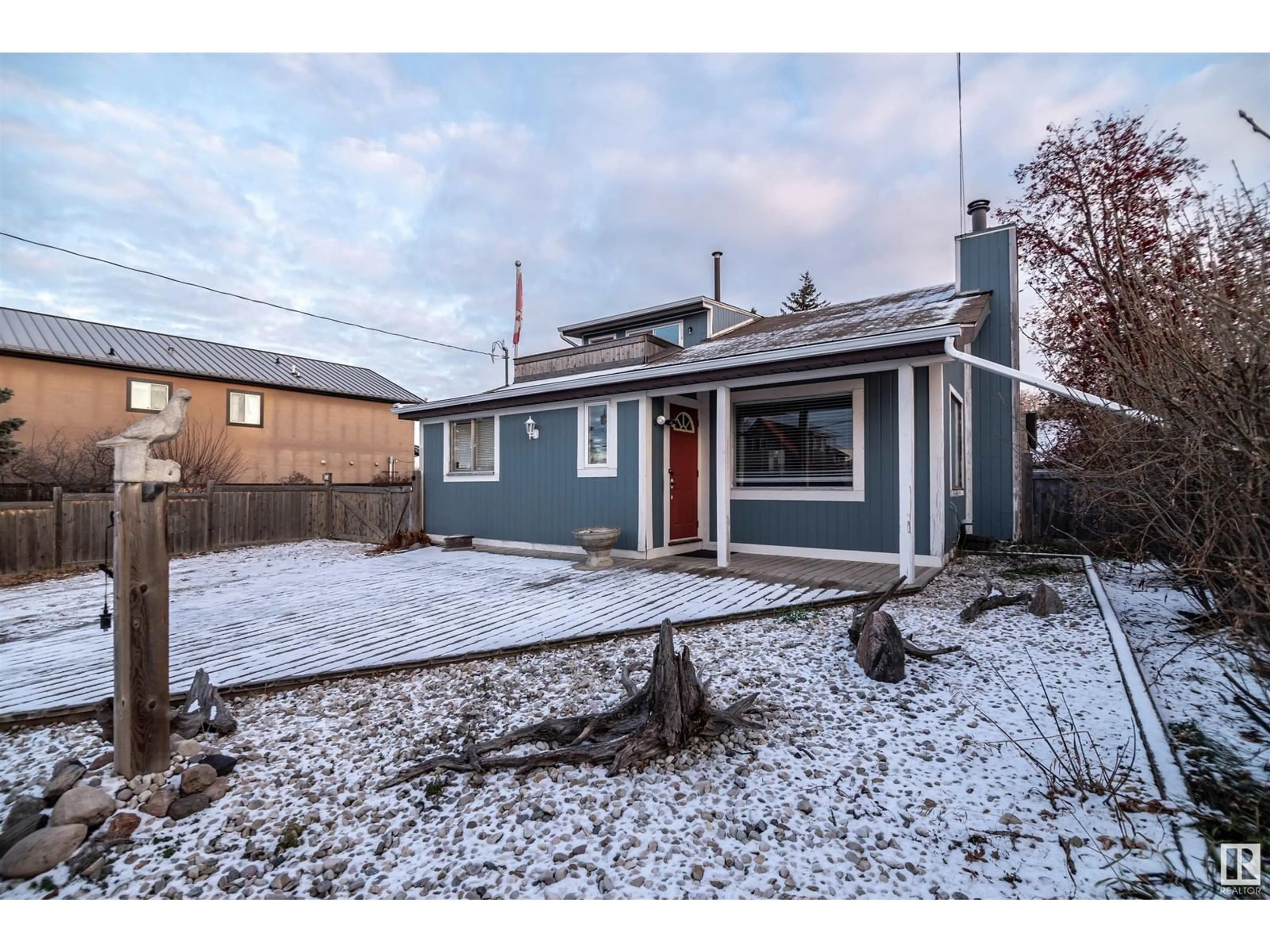 Frontside or backside of a home, the fenced backyard for 5031 and 5035 50 AV, Rural Lac Ste. Anne County Alberta T0E0A0