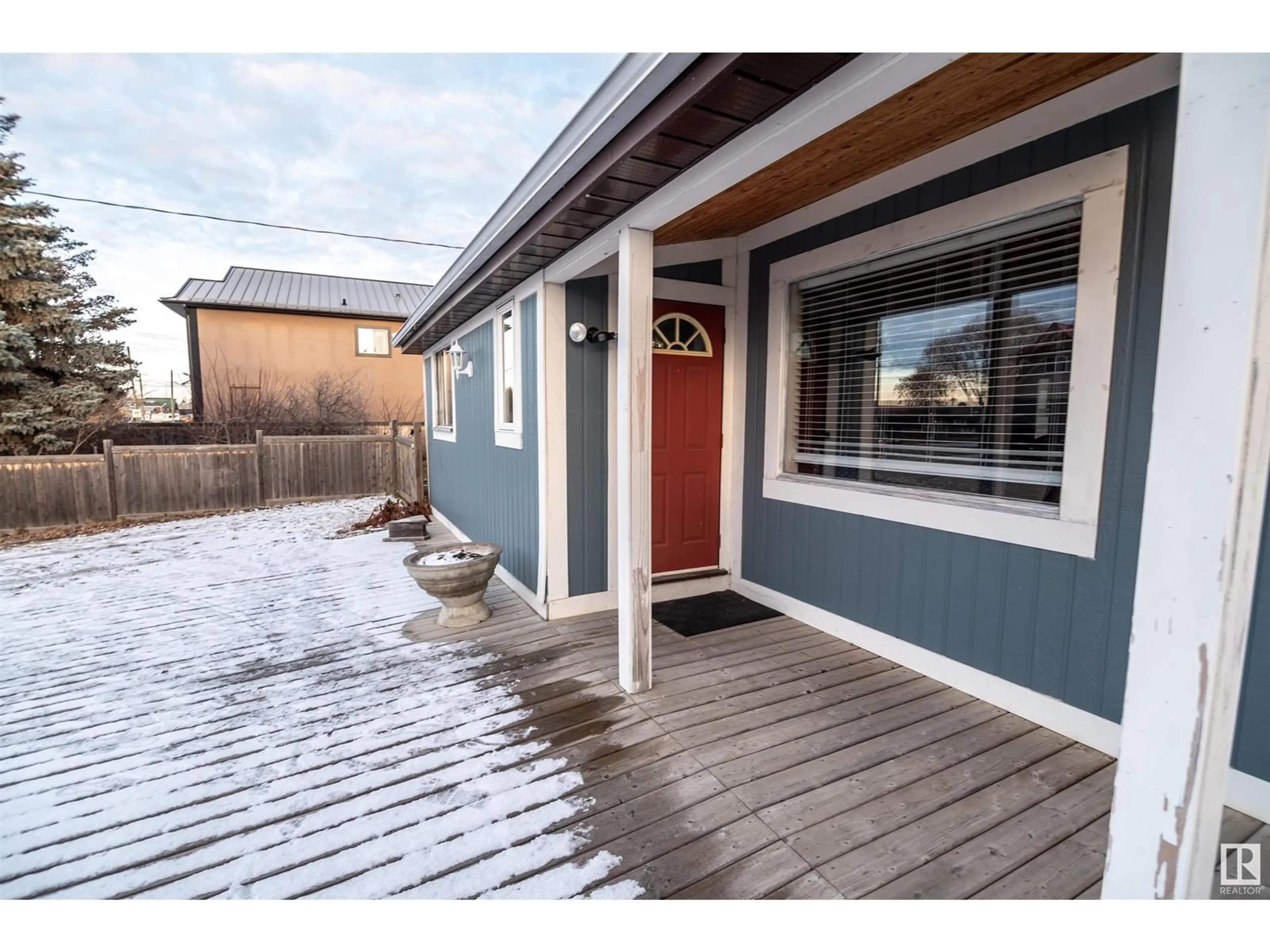 Frontside or backside of a home, the fenced backyard for 5031 and 5035 50 AV, Rural Lac Ste. Anne County Alberta T0E0A0