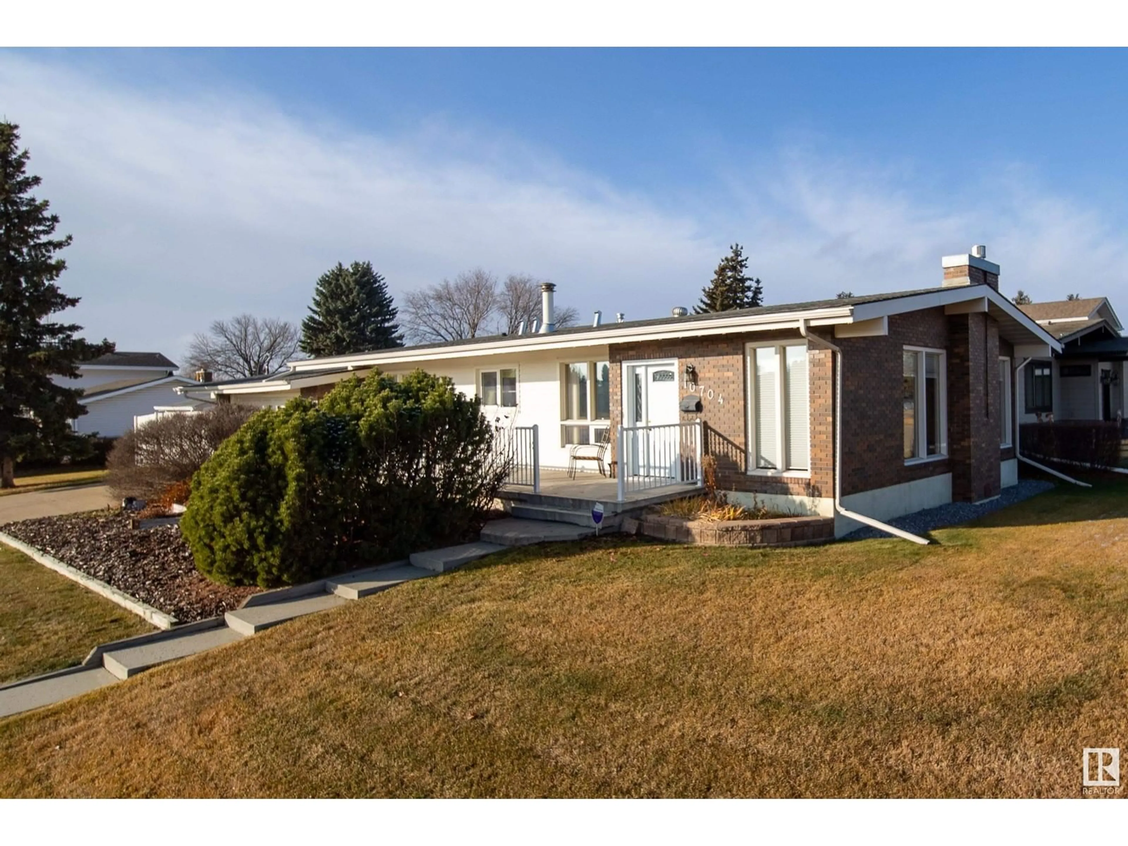 Frontside or backside of a home, the fenced backyard for 10704 37 AV NW NW, Edmonton Alberta T6J0G5