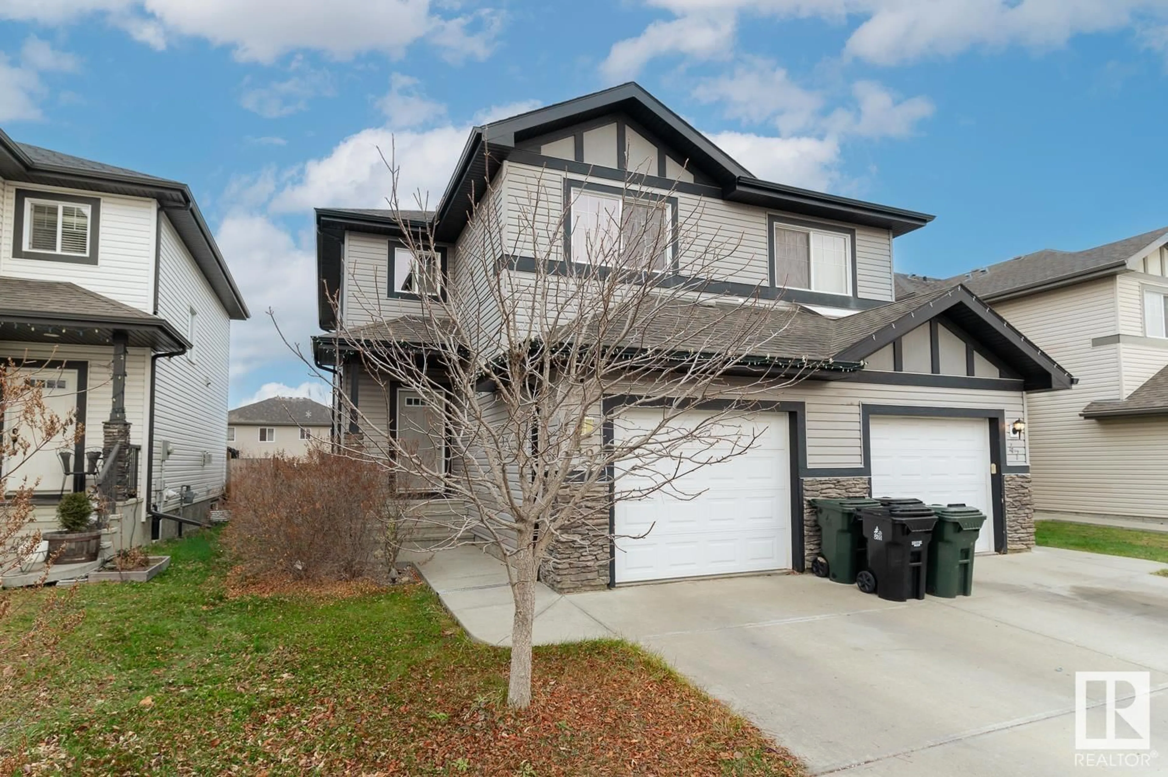 Frontside or backside of a home, the street view for 49 HARTWICK CO, Spruce Grove Alberta T7X0K2