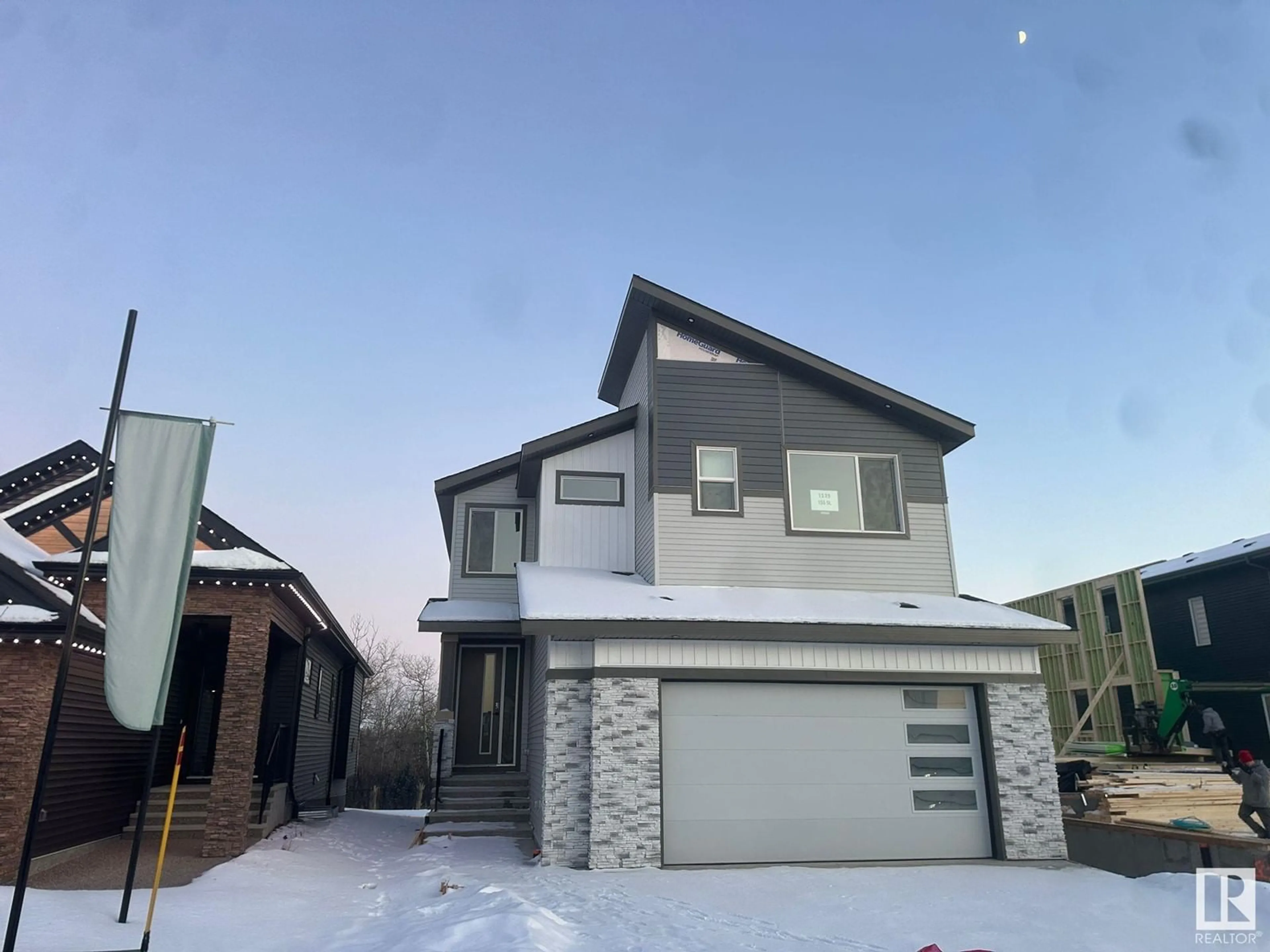 Home with vinyl exterior material, street for 1339 155 ST SW, Edmonton Alberta T6W5J5