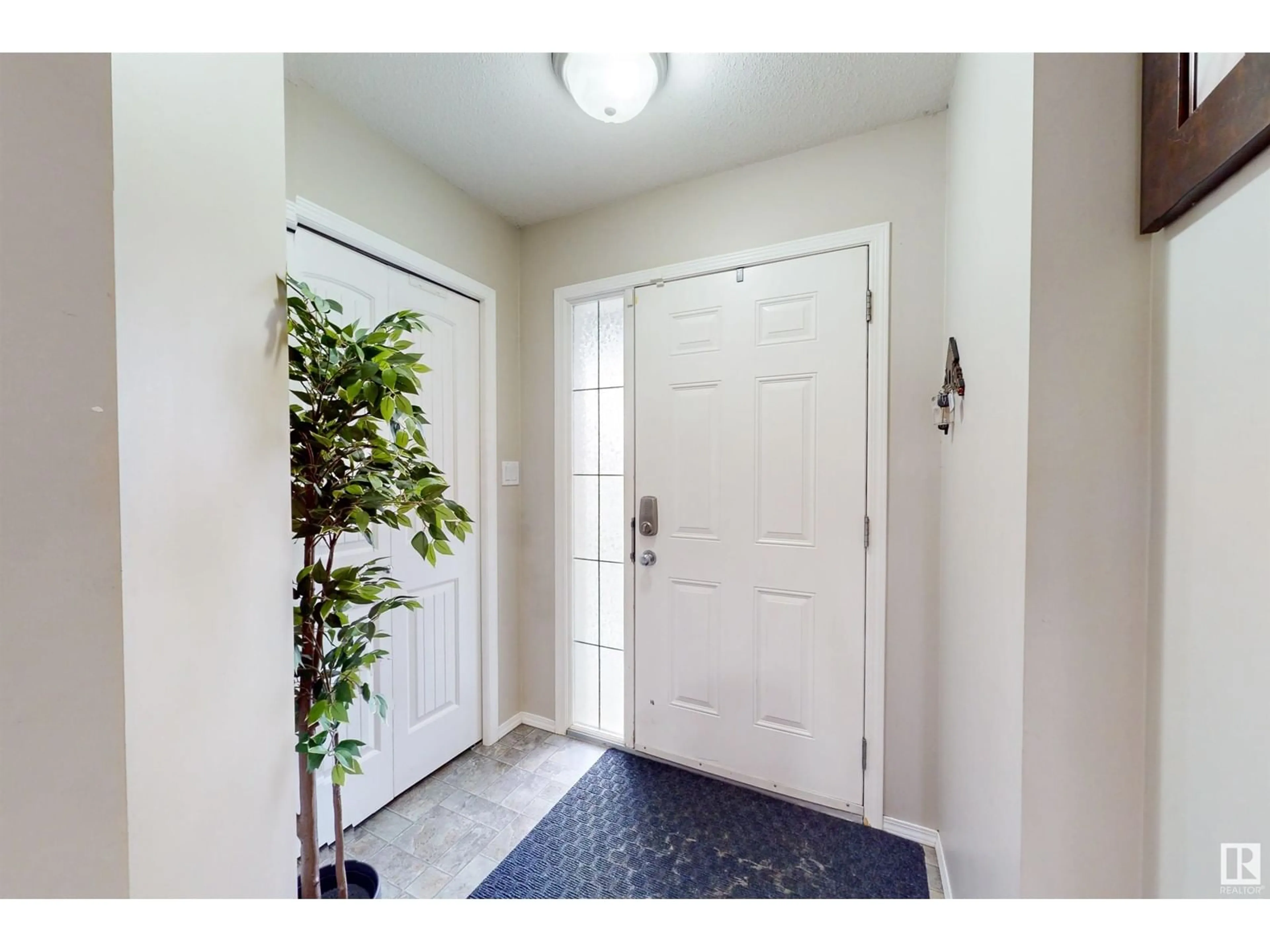 Indoor entryway, wood floors for 2031 Hammond Cl NW, Edmonton Alberta T6M0K2