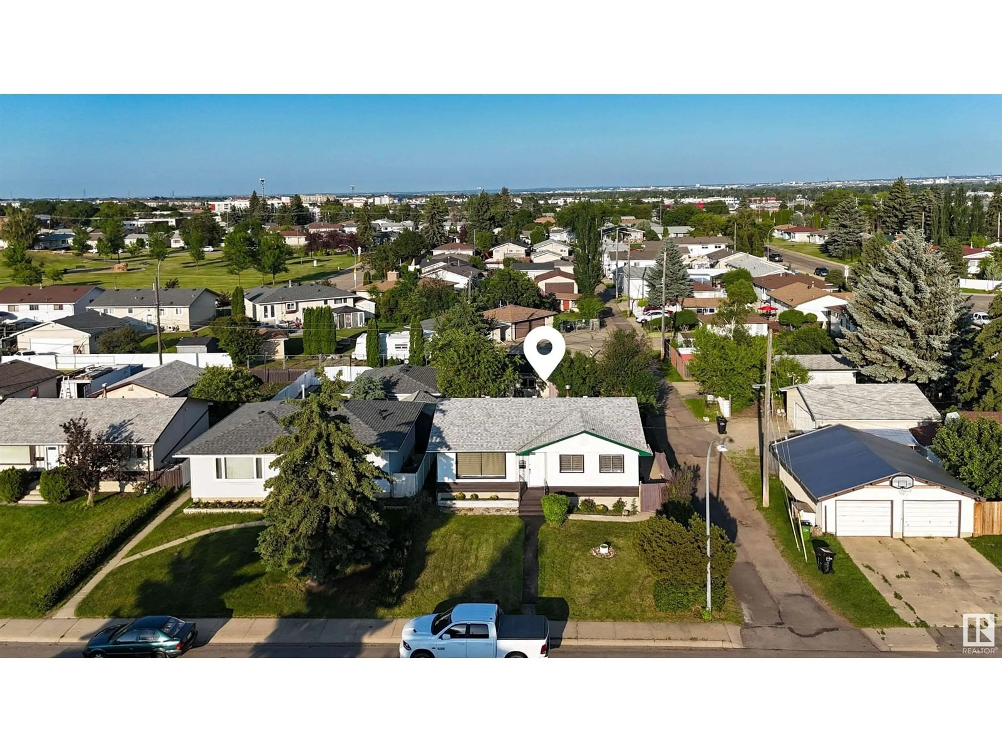 Frontside or backside of a home, the street view for 13411 61 ST NW, Edmonton Alberta T5A0T4