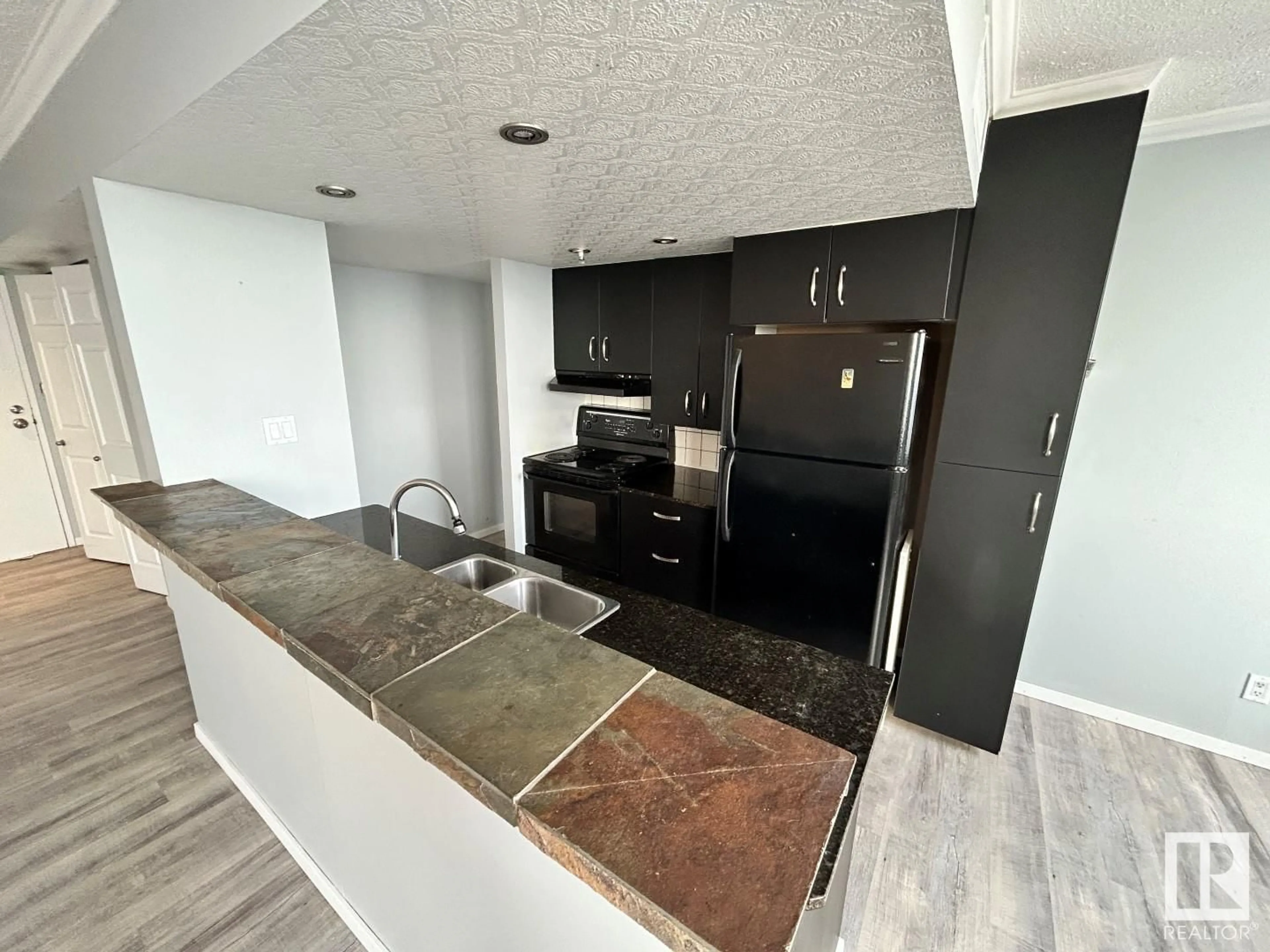 Open concept kitchen for #2205 9909 104 ST NW, Edmonton Alberta T5K2G5