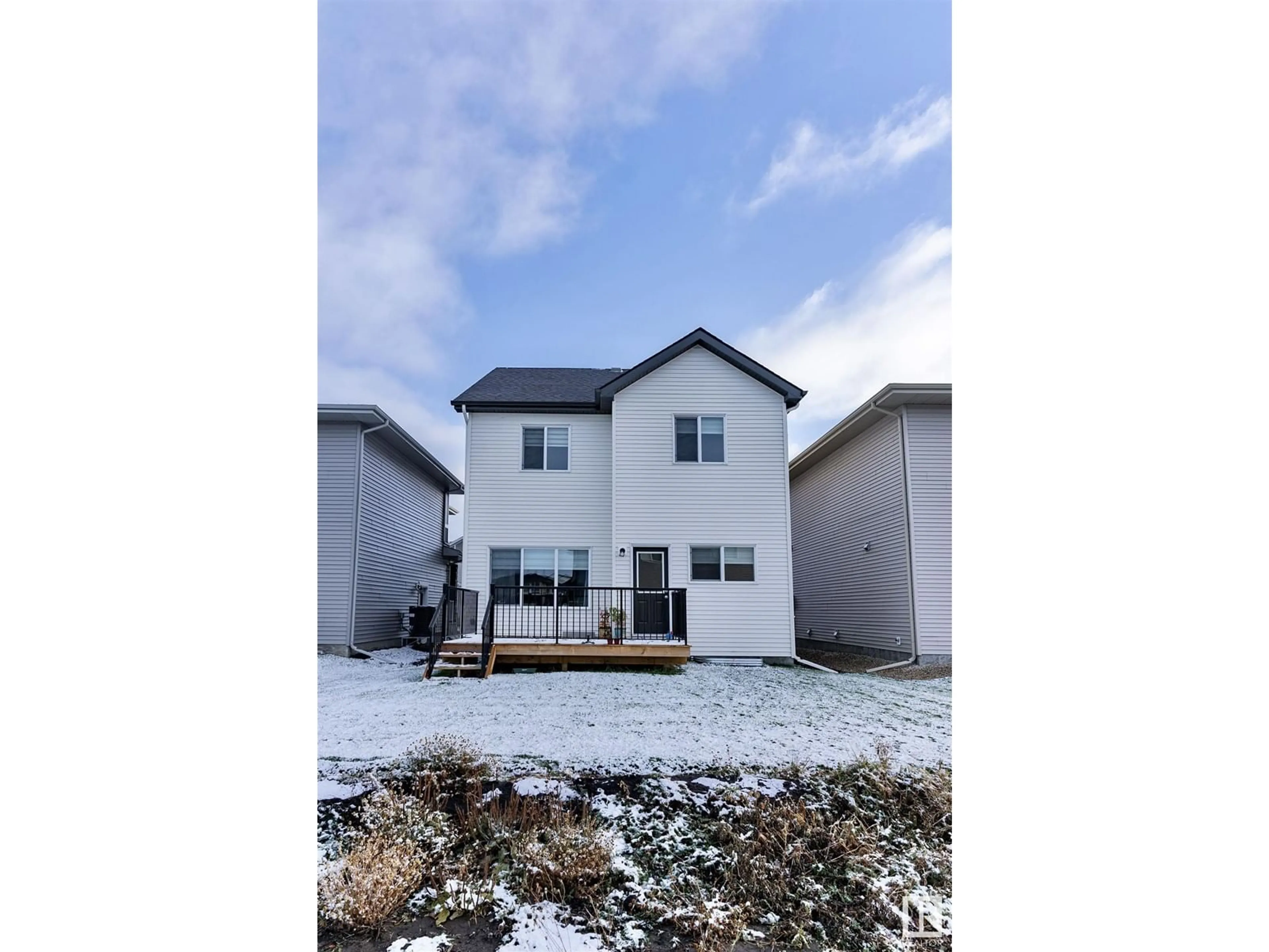 Frontside or backside of a home, the fenced backyard for 19412 25 AV NW, Edmonton Alberta T6M1P5