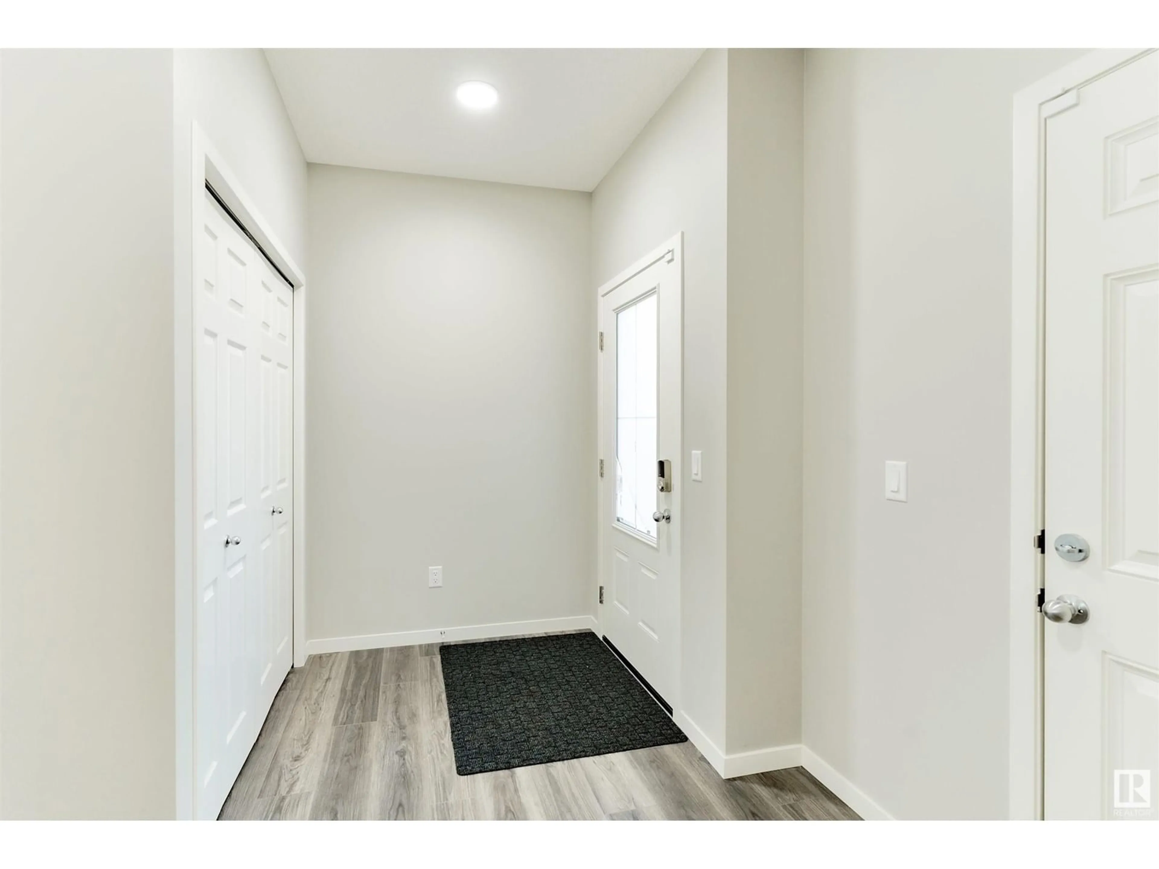 Indoor entryway, wood floors for 19412 25 AV NW, Edmonton Alberta T6M1P5