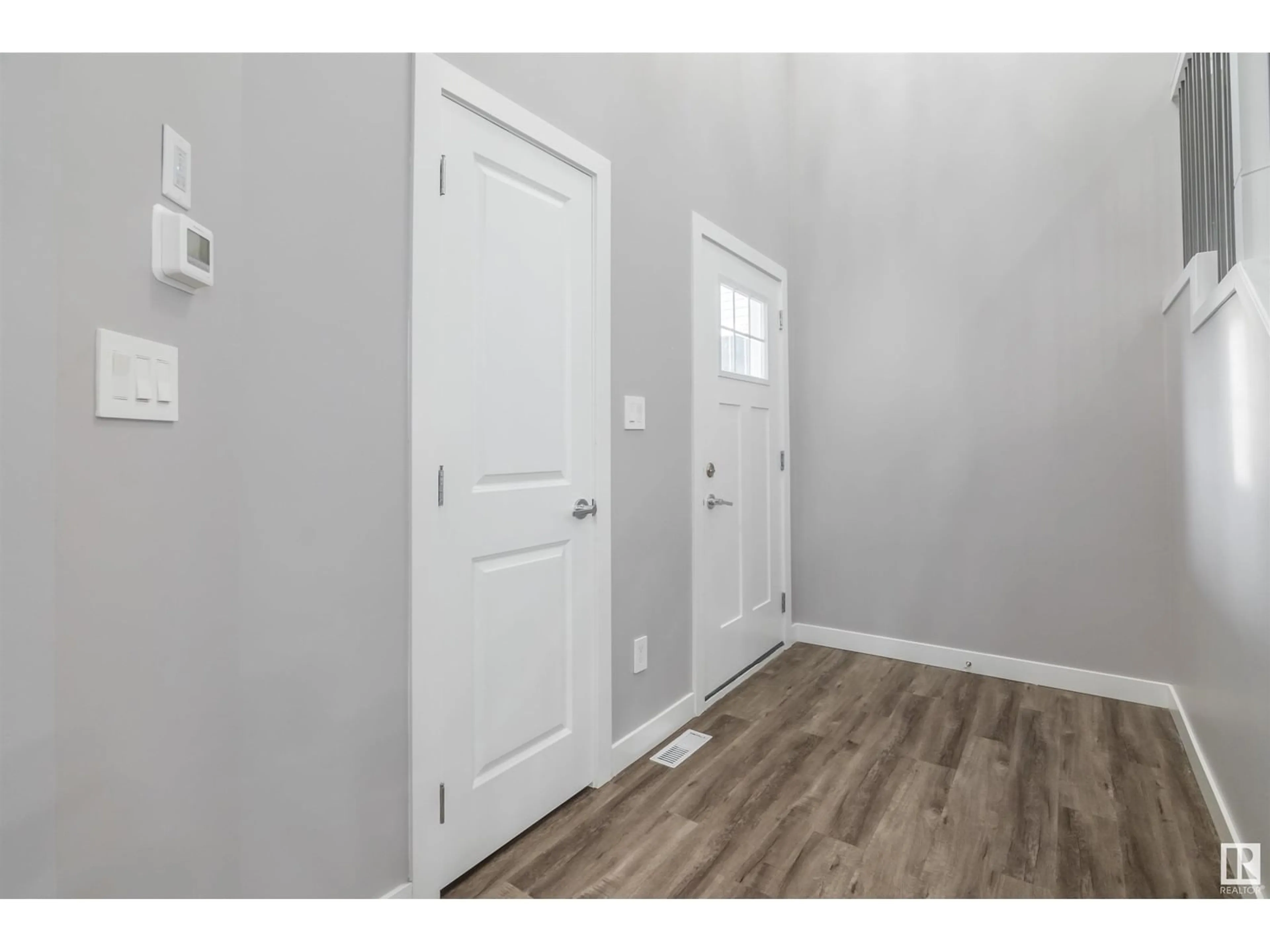 Indoor entryway, wood floors for #26 1703 16 AV NW, Edmonton Alberta T6T2C3