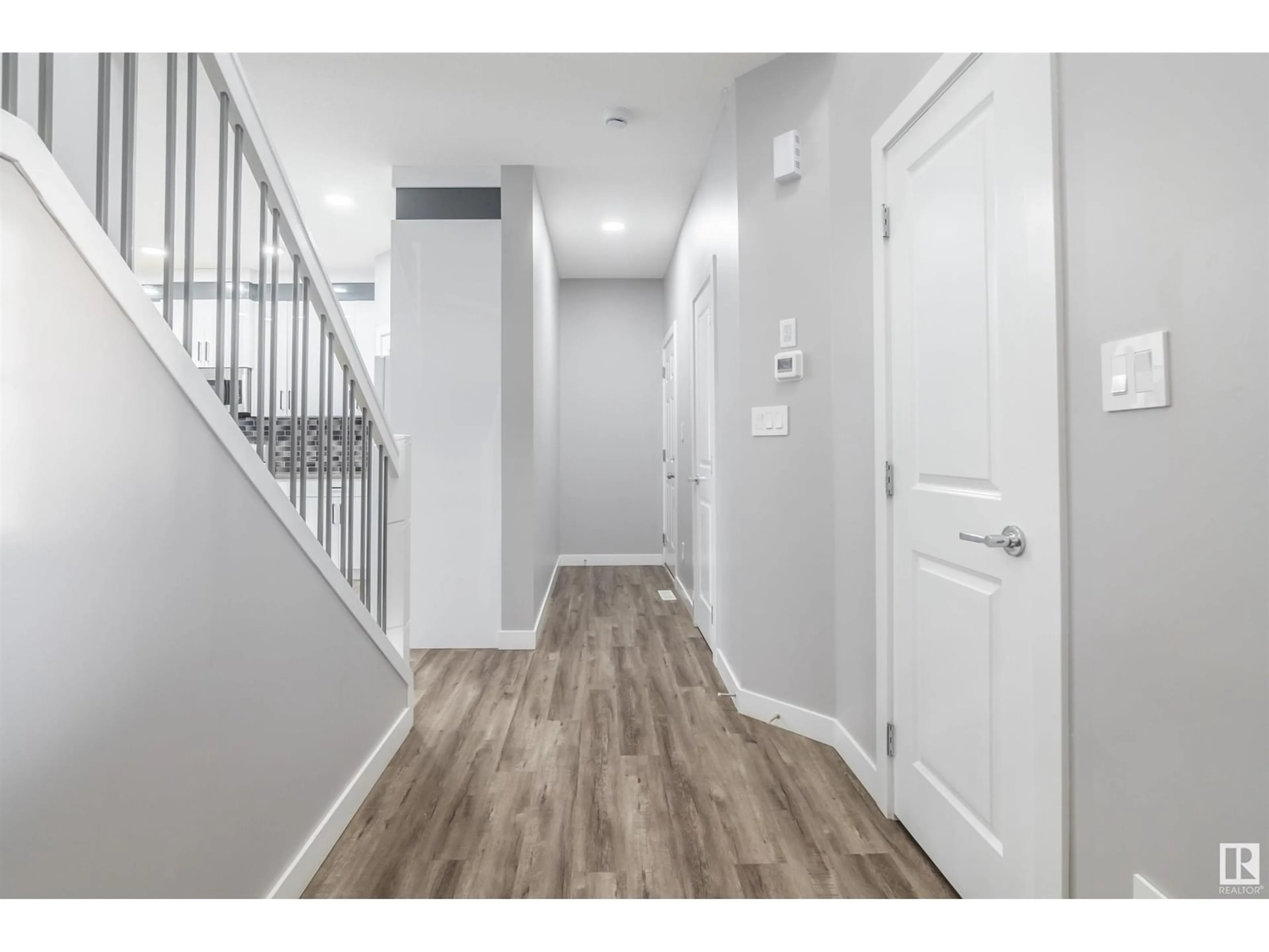 Indoor entryway, wood floors for #26 1703 16 AV NW, Edmonton Alberta T6T2C3