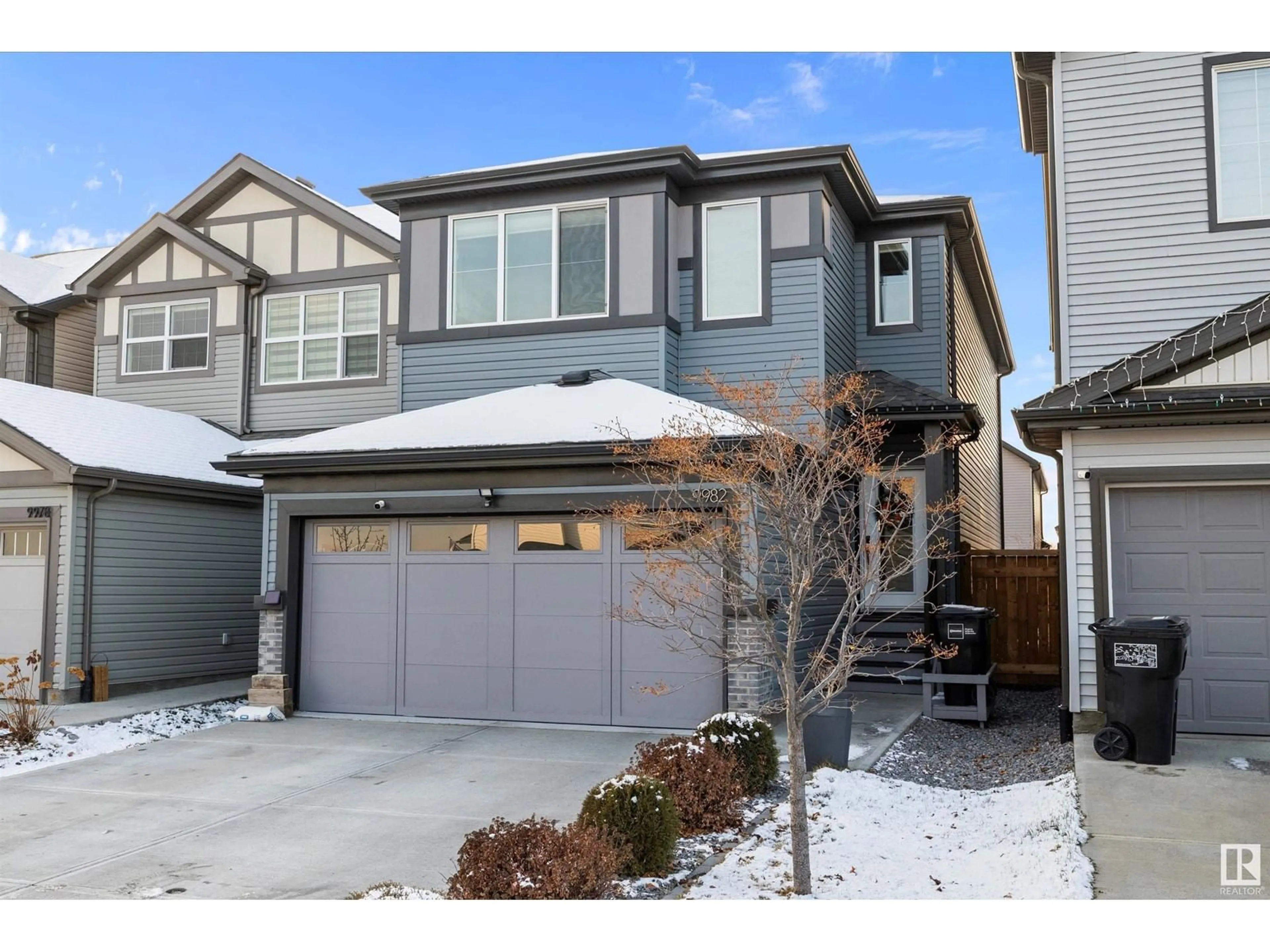 A pic from exterior of the house or condo, the fenced backyard for 9982 205A ST NW, Edmonton Alberta T5T7N4