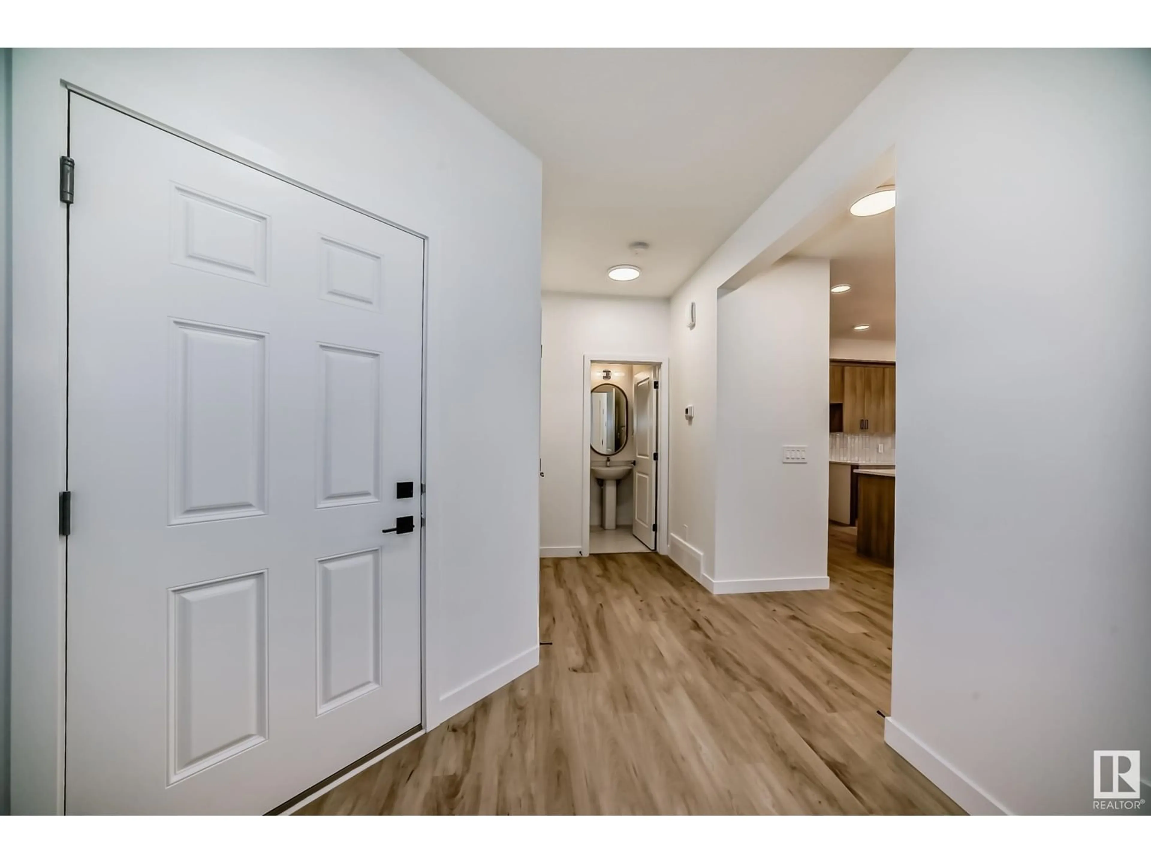 Indoor entryway, wood floors for 6404 27 AV SW, Edmonton Alberta T6X3G4