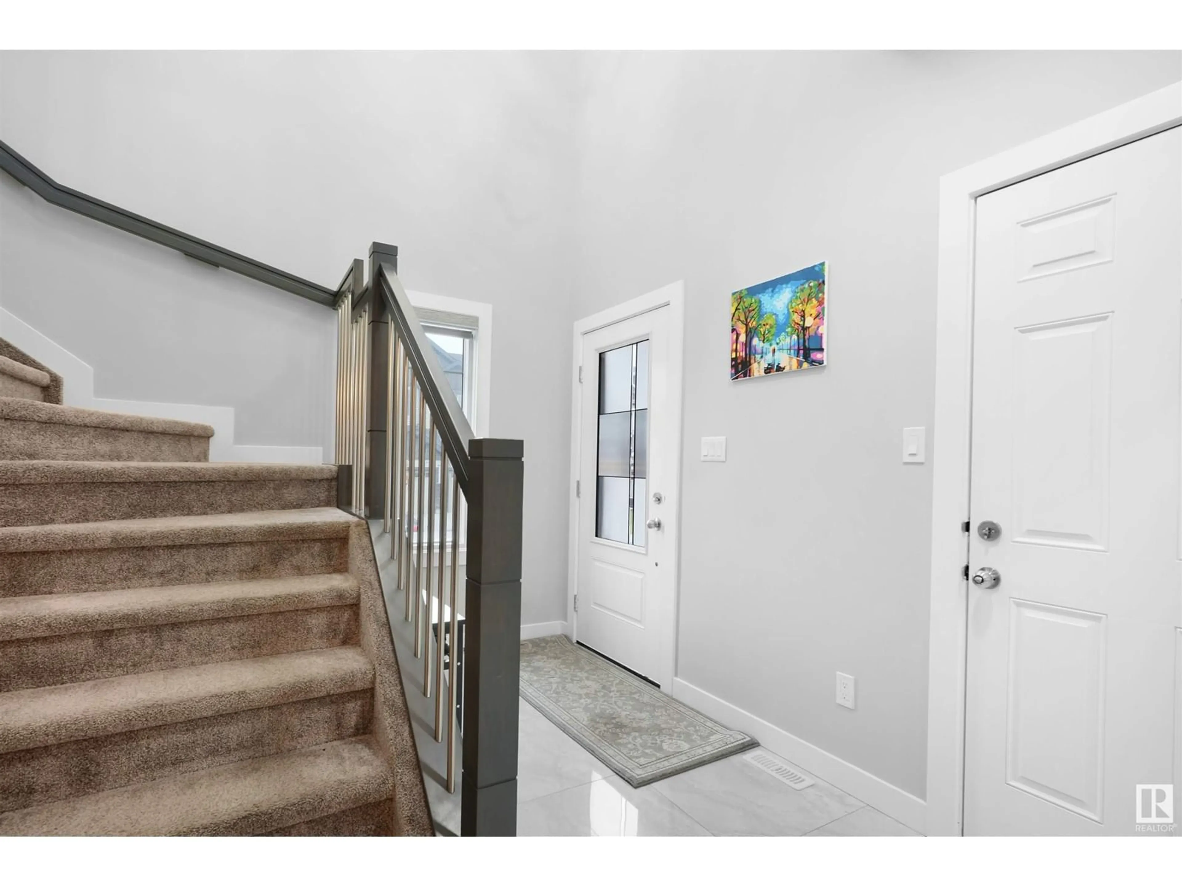 Indoor entryway, wood floors for 6504 168 AV NW, Edmonton Alberta T5Y3X9