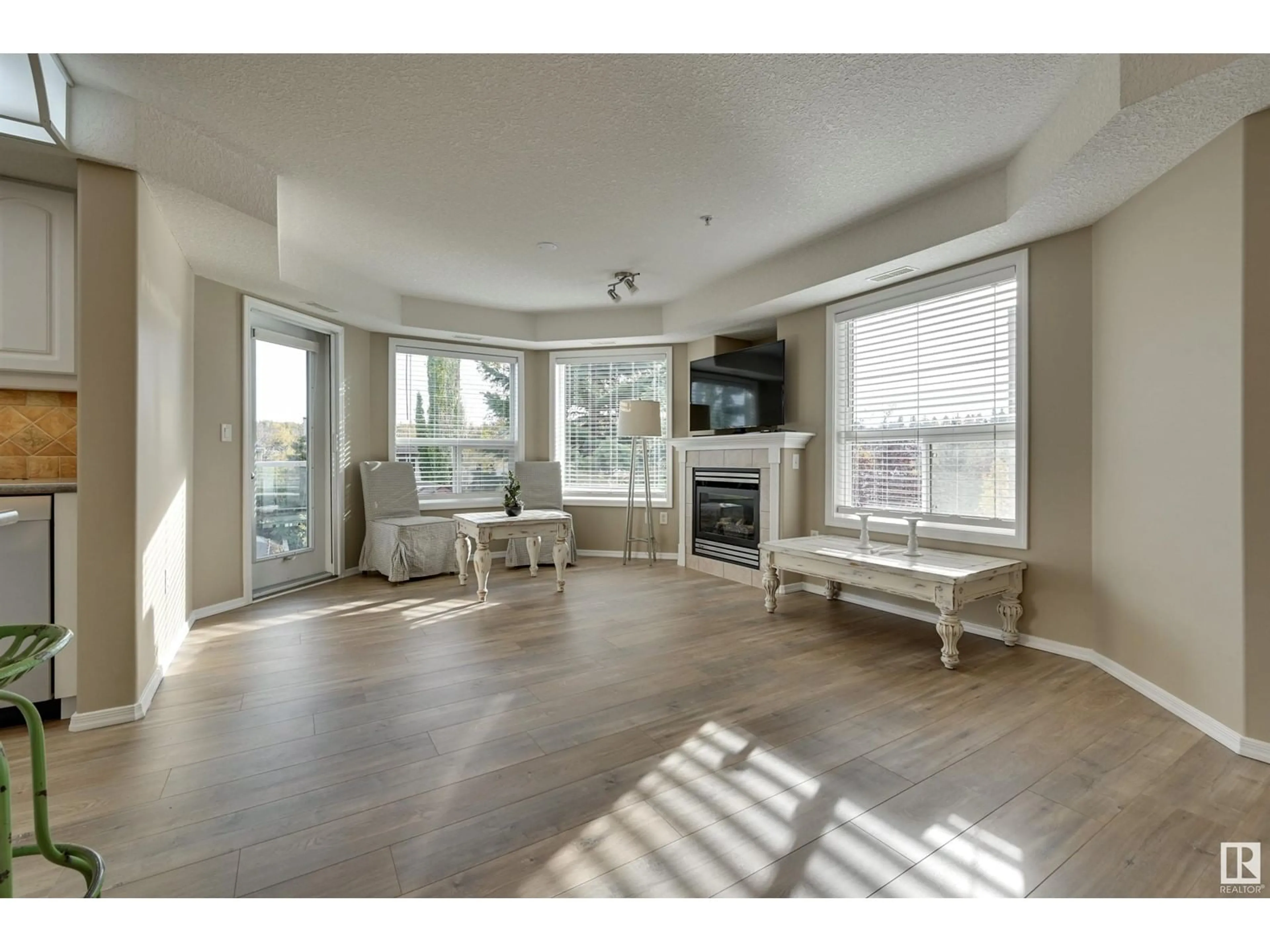 A pic of a room, wood floors for #312 9008 99 AV NW, Edmonton Alberta T5H4M6