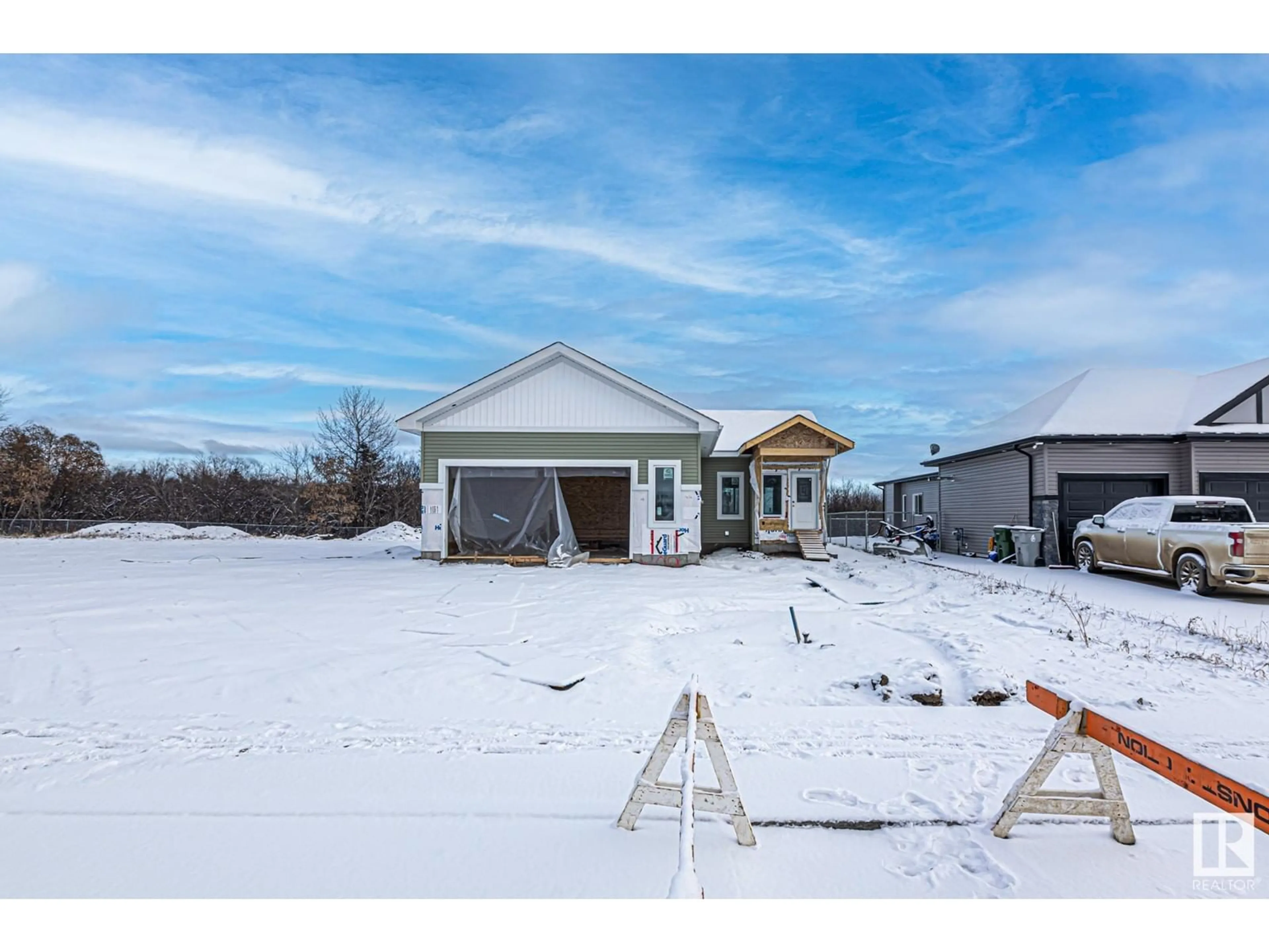 Frontside or backside of a home, the fenced backyard for #16 5109 55 street, Wabamun Alberta T0E2K0