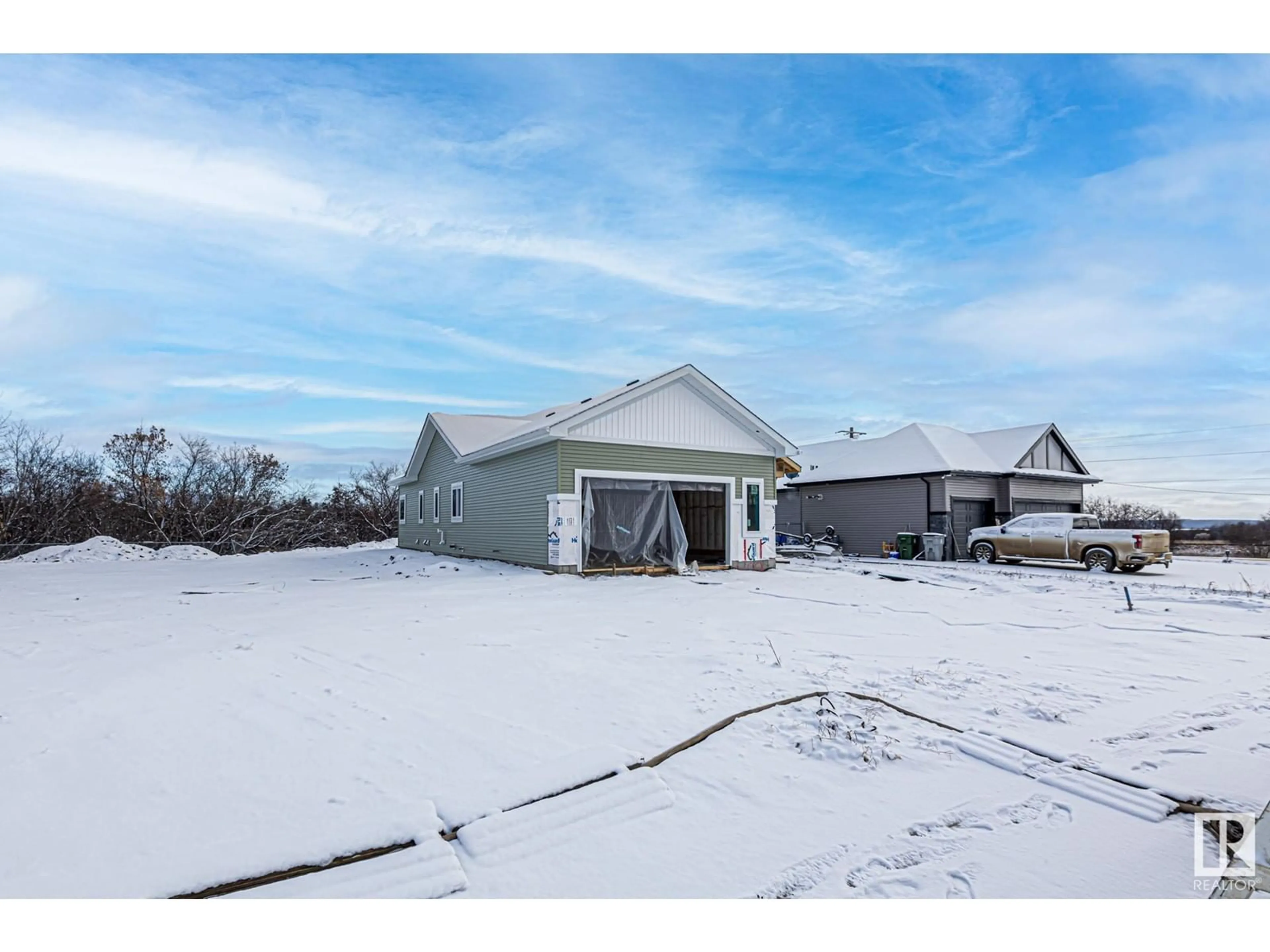 A pic from exterior of the house or condo, the fenced backyard for #16 5109 55 street, Wabamun Alberta T0E2K0