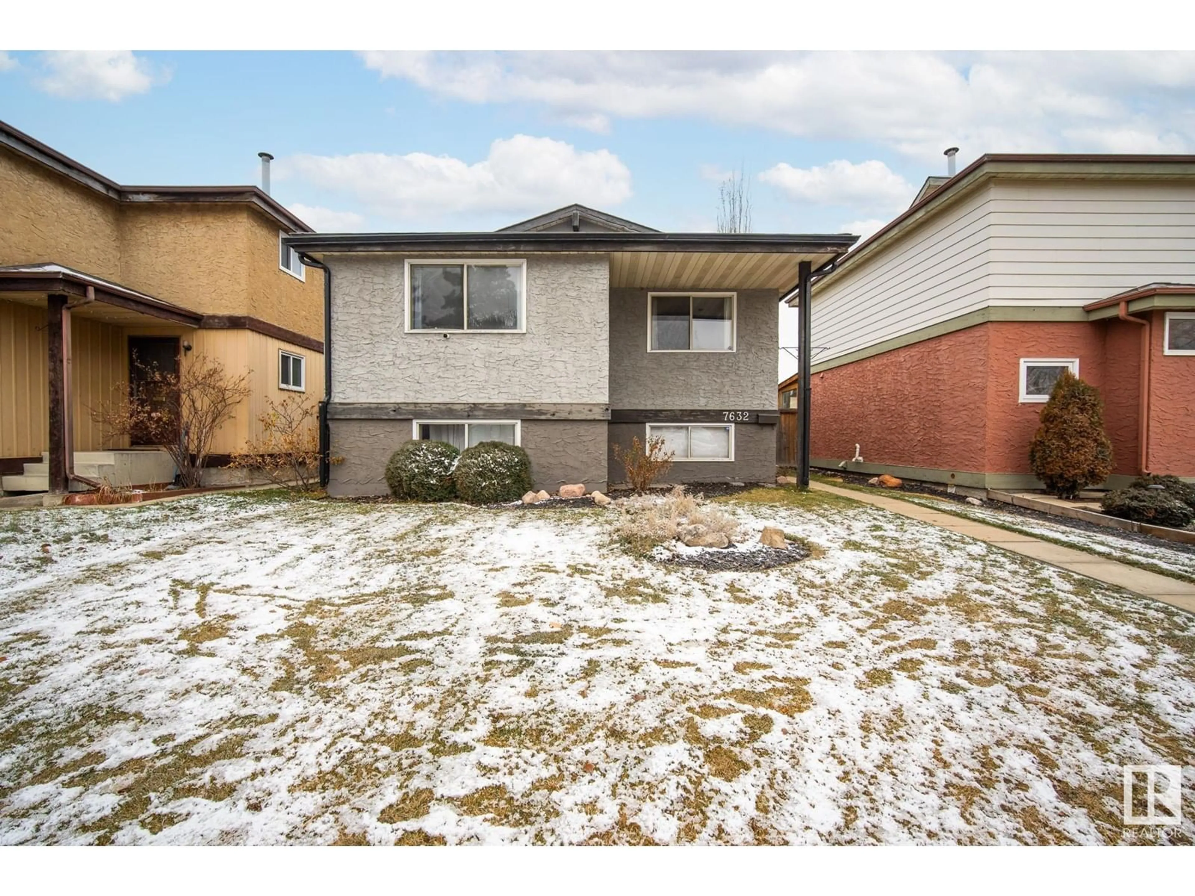 Frontside or backside of a home, the fenced backyard for 7632 180 ST NW, Edmonton Alberta T5T2L1