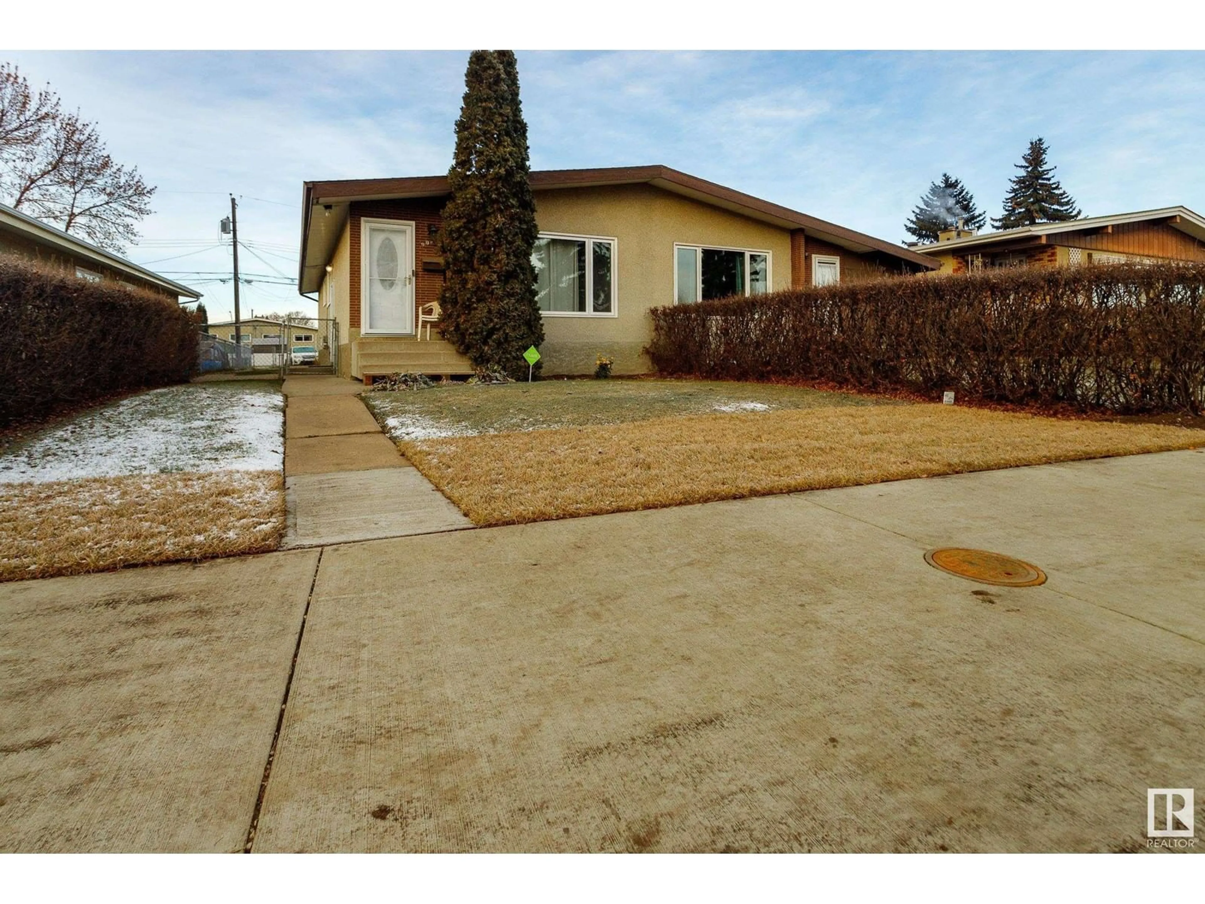 Frontside or backside of a home, the street view for 9026 58 ST NW, Edmonton Alberta T6B1K9