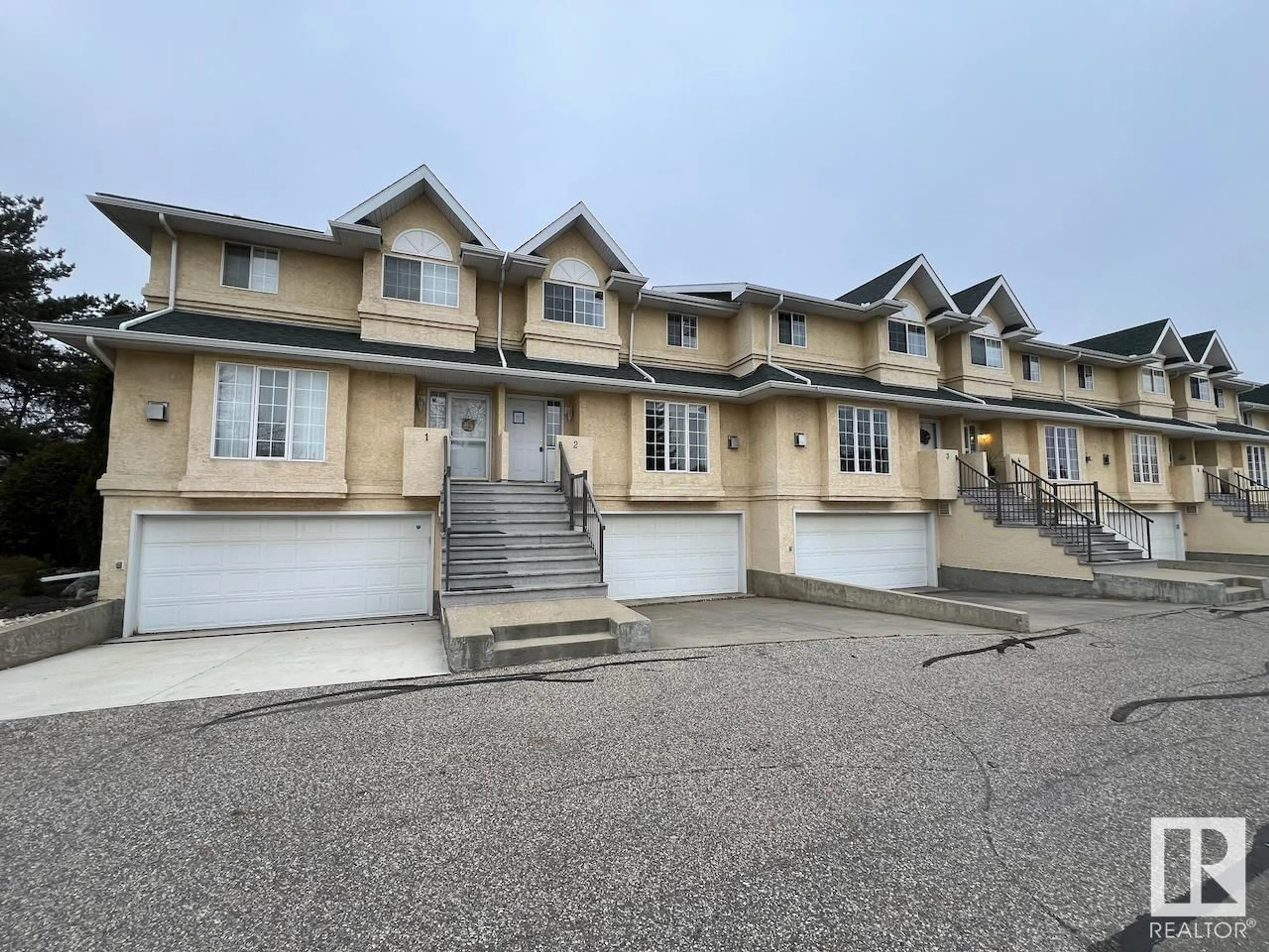 A pic from exterior of the house or condo, the street view for #2 2419 133 AV NW, Edmonton Alberta T5A5A5