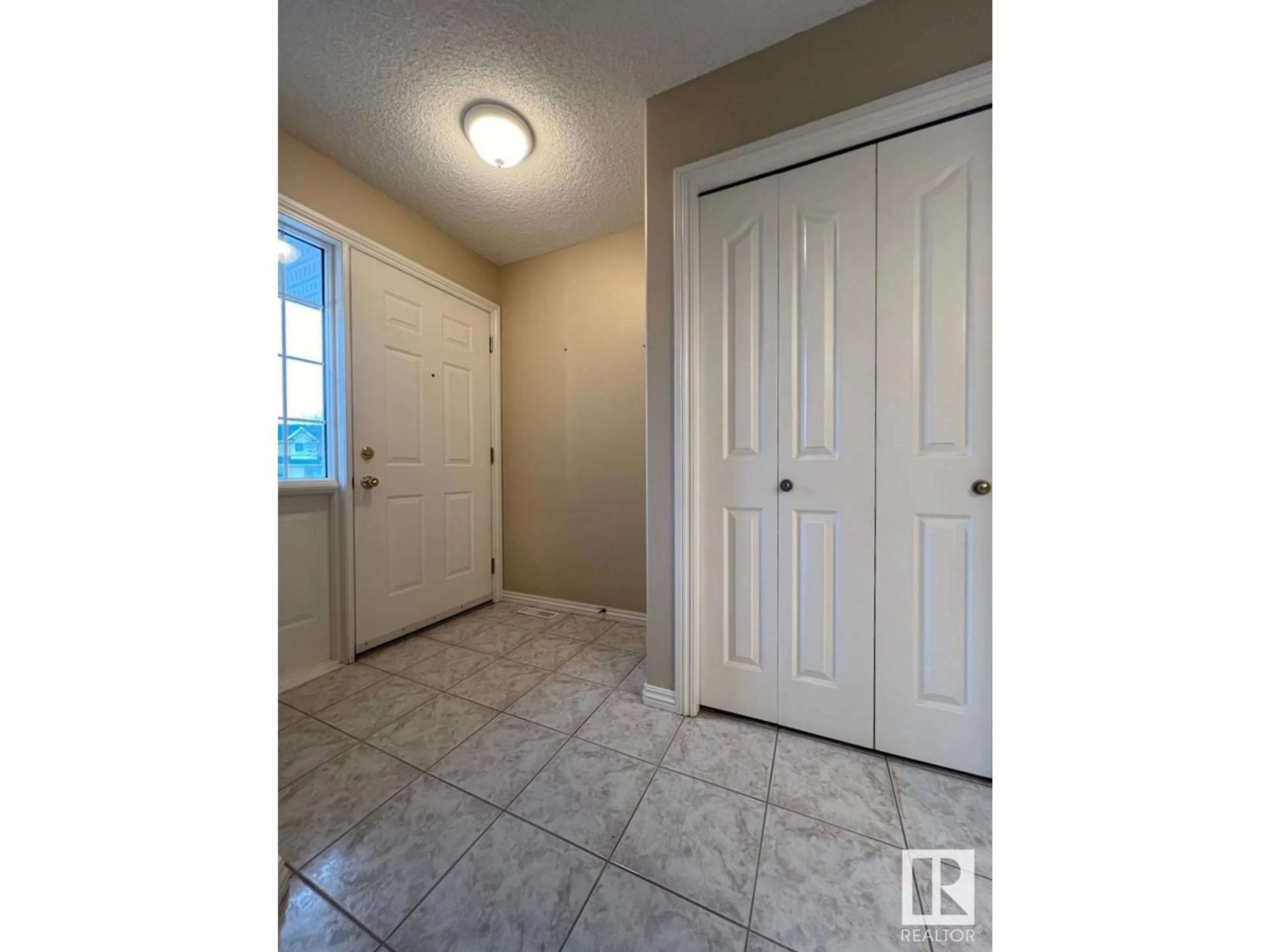 Indoor entryway, unknown floor for #2 2419 133 AV NW, Edmonton Alberta T5A5A5